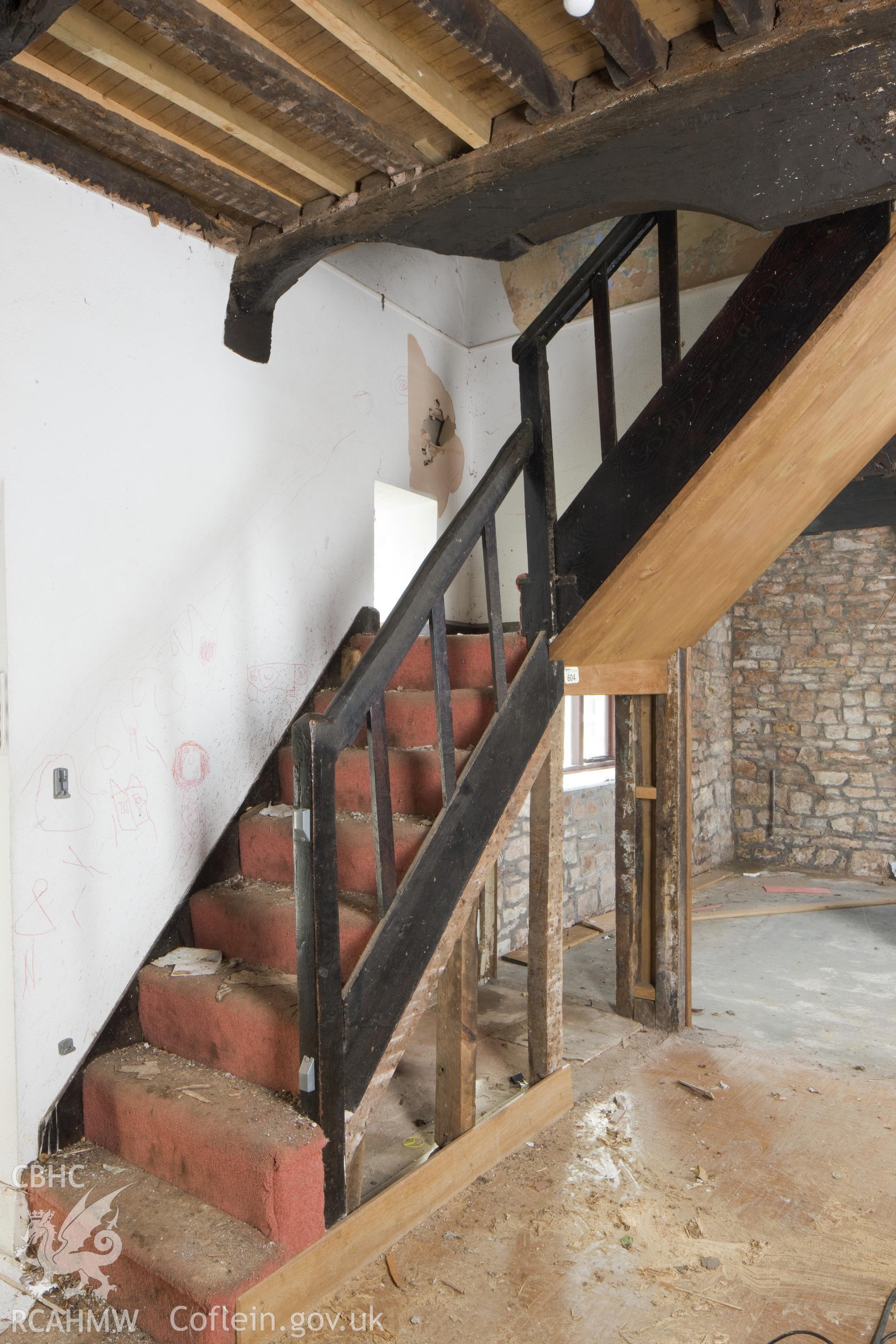 Staircase with carved door heads.
