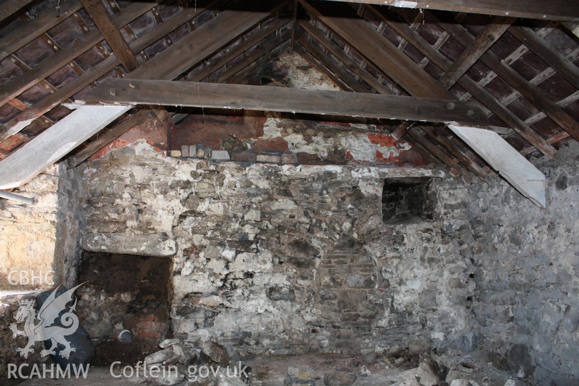 Base of stair projection view towards blocked hall doorway.
