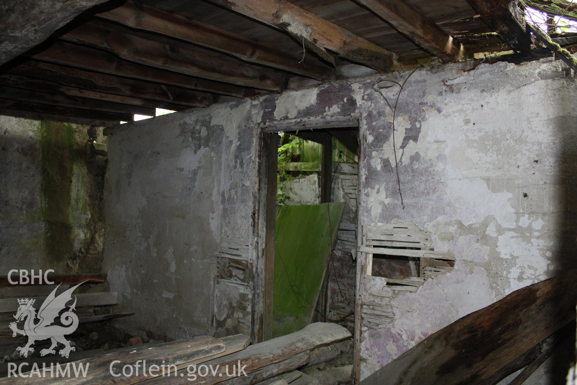 Lath and plaster partition between passage and kitchen