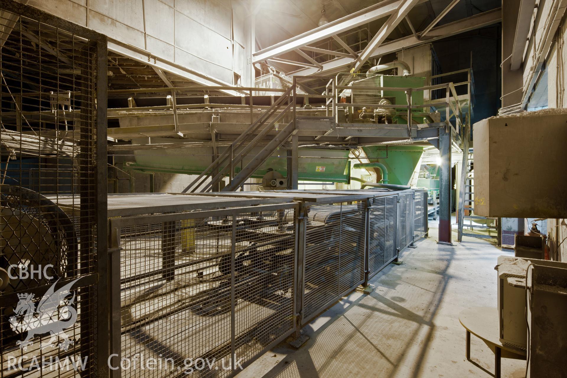 Interior of the Salt Island Transfer Station showing the upper jetty conveyor belt feeding the lower mainland conveyor belt. Taken by Iain Wright, 5/10/11.