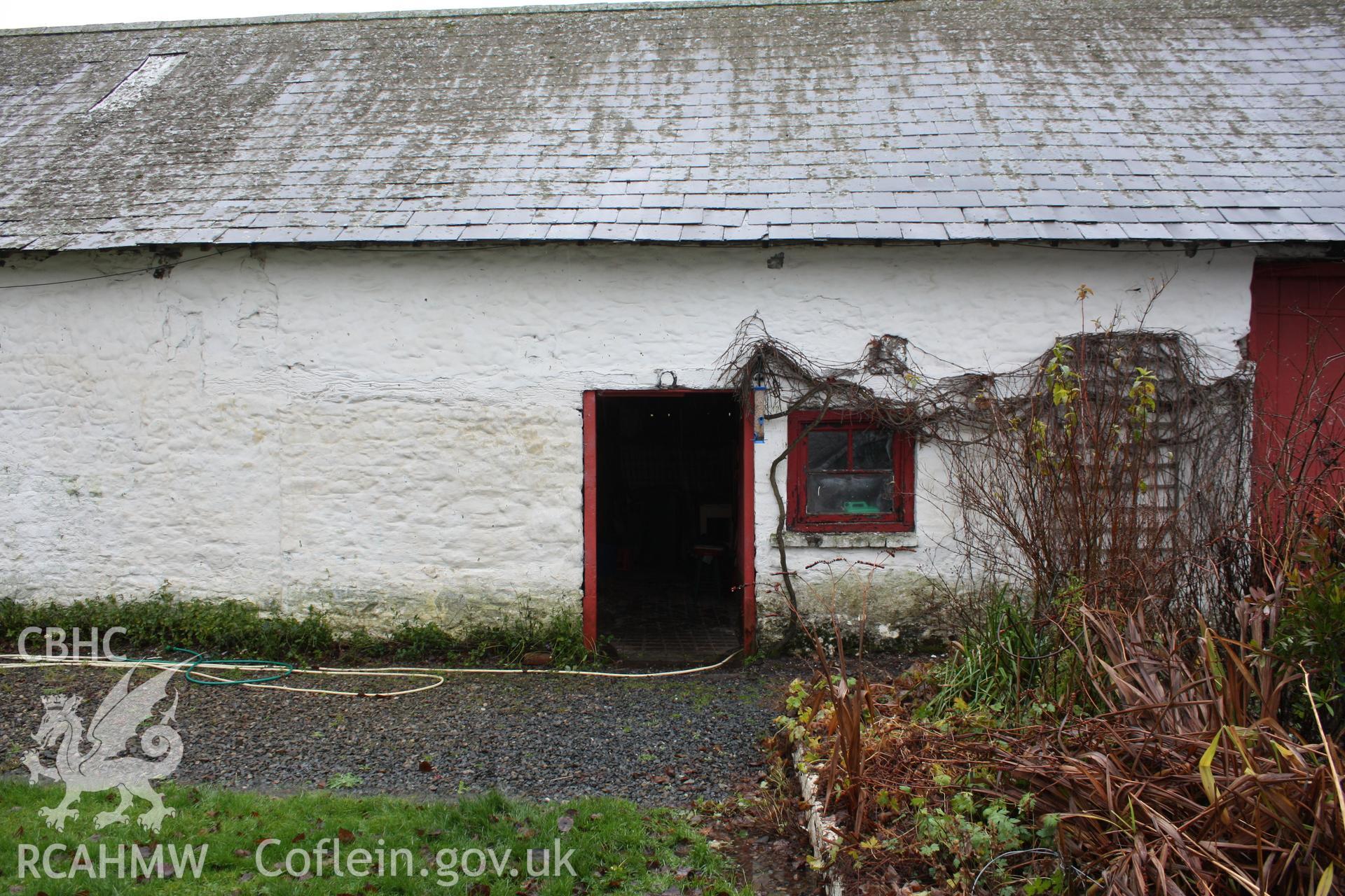 Exterior, view of stable/cow-house doorway in north-east elevation.