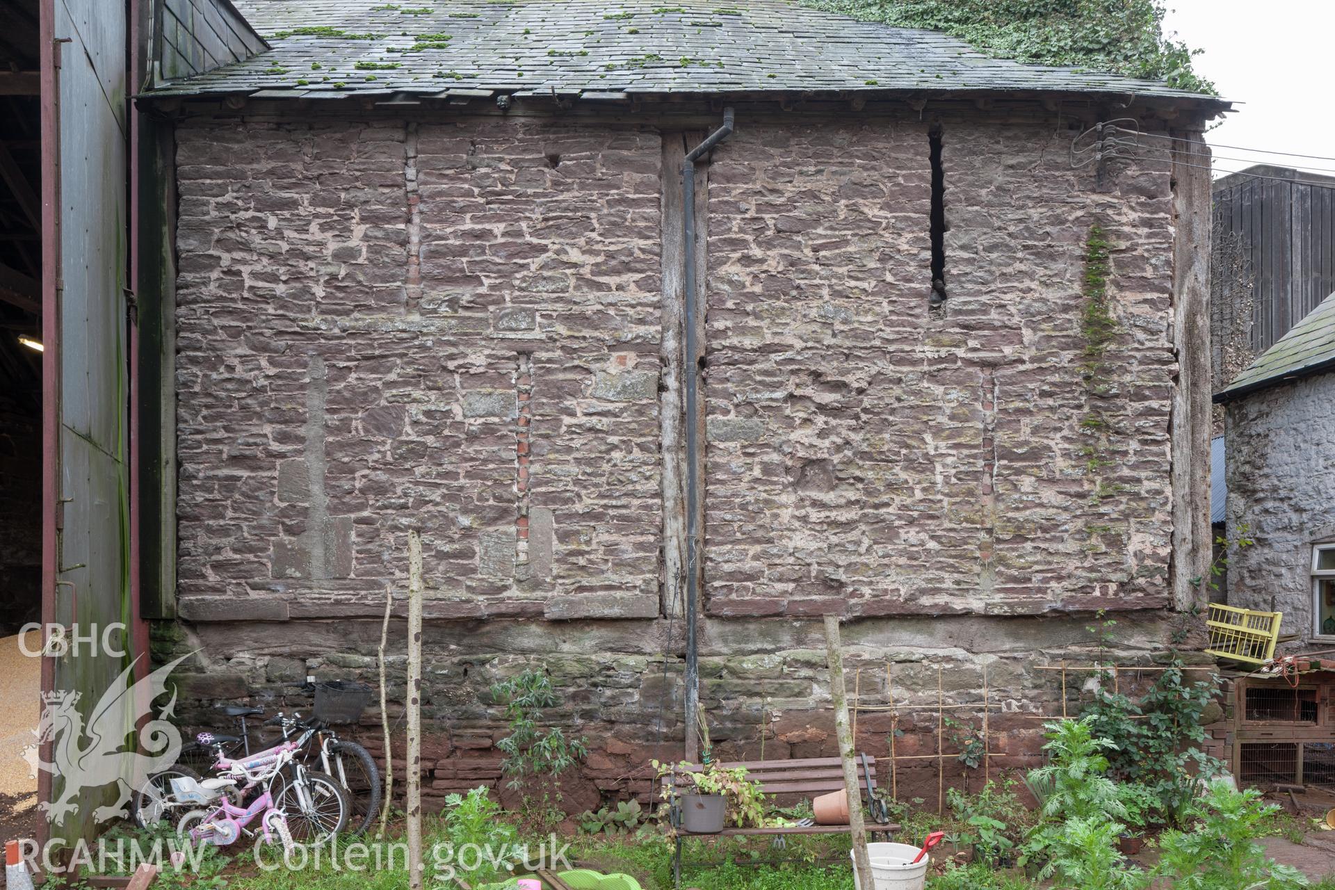 Right wall of barn showing early timber framing