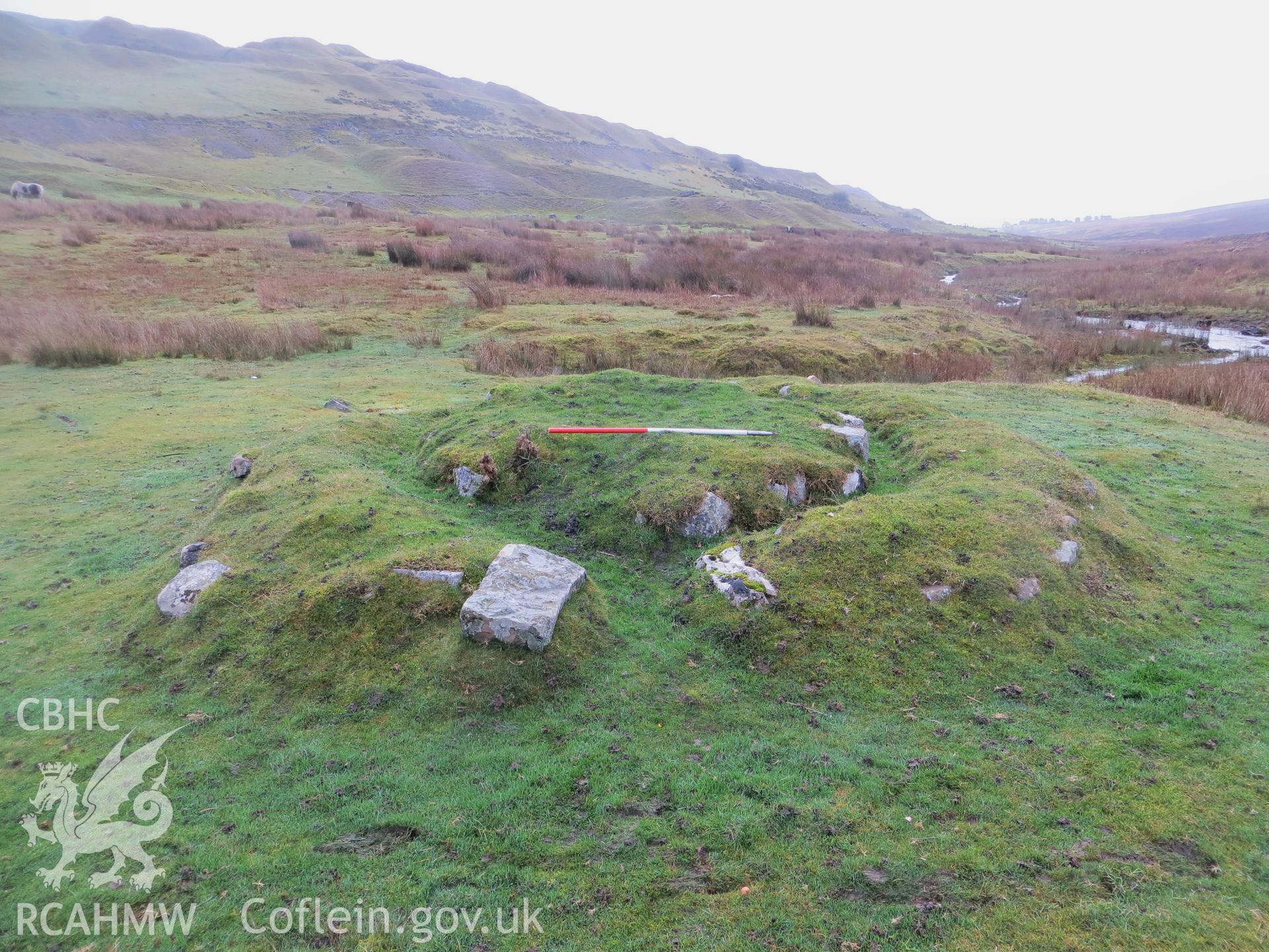 View from the north-west showing entrance gap in bench; 1m scale.
