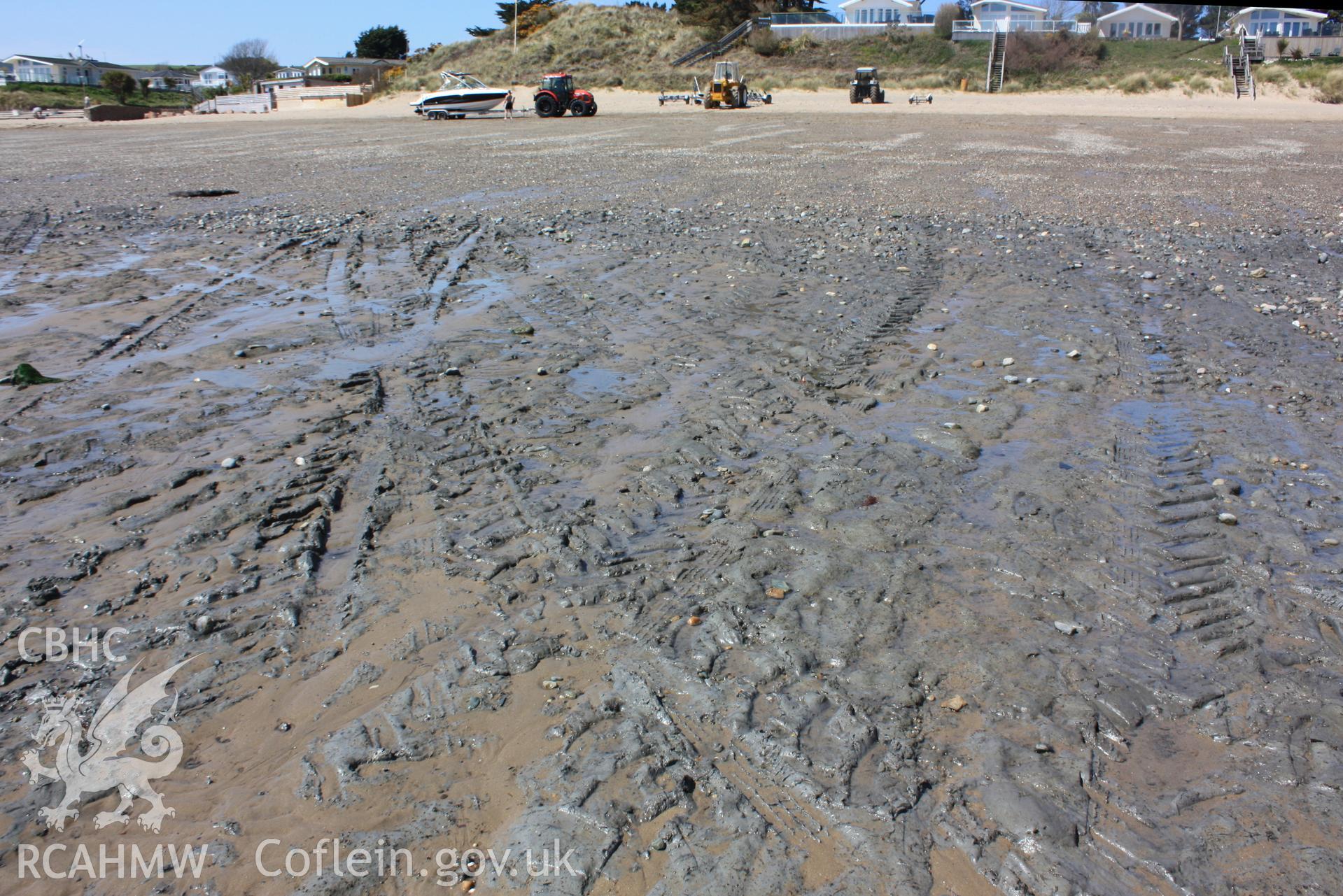 Exposure of underlying grey clays with tyre tracks of launch tractors