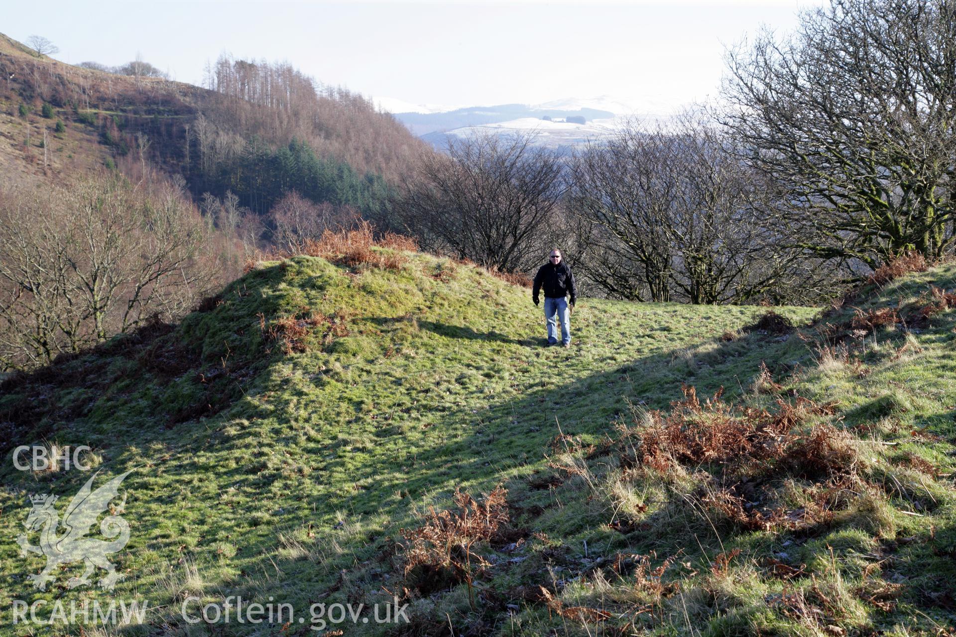 Castell Grogwynion hillfort, Royal Commission survey 2012, view of north-east gateway bastion with figure for scale