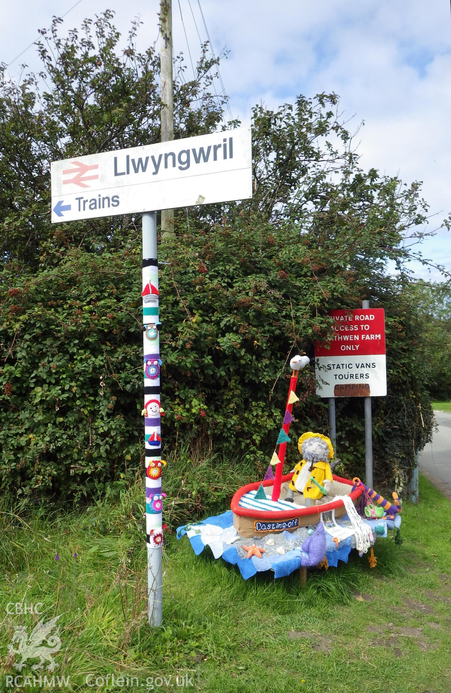 Sailing boat near Llwyngwril station and decorated station sign