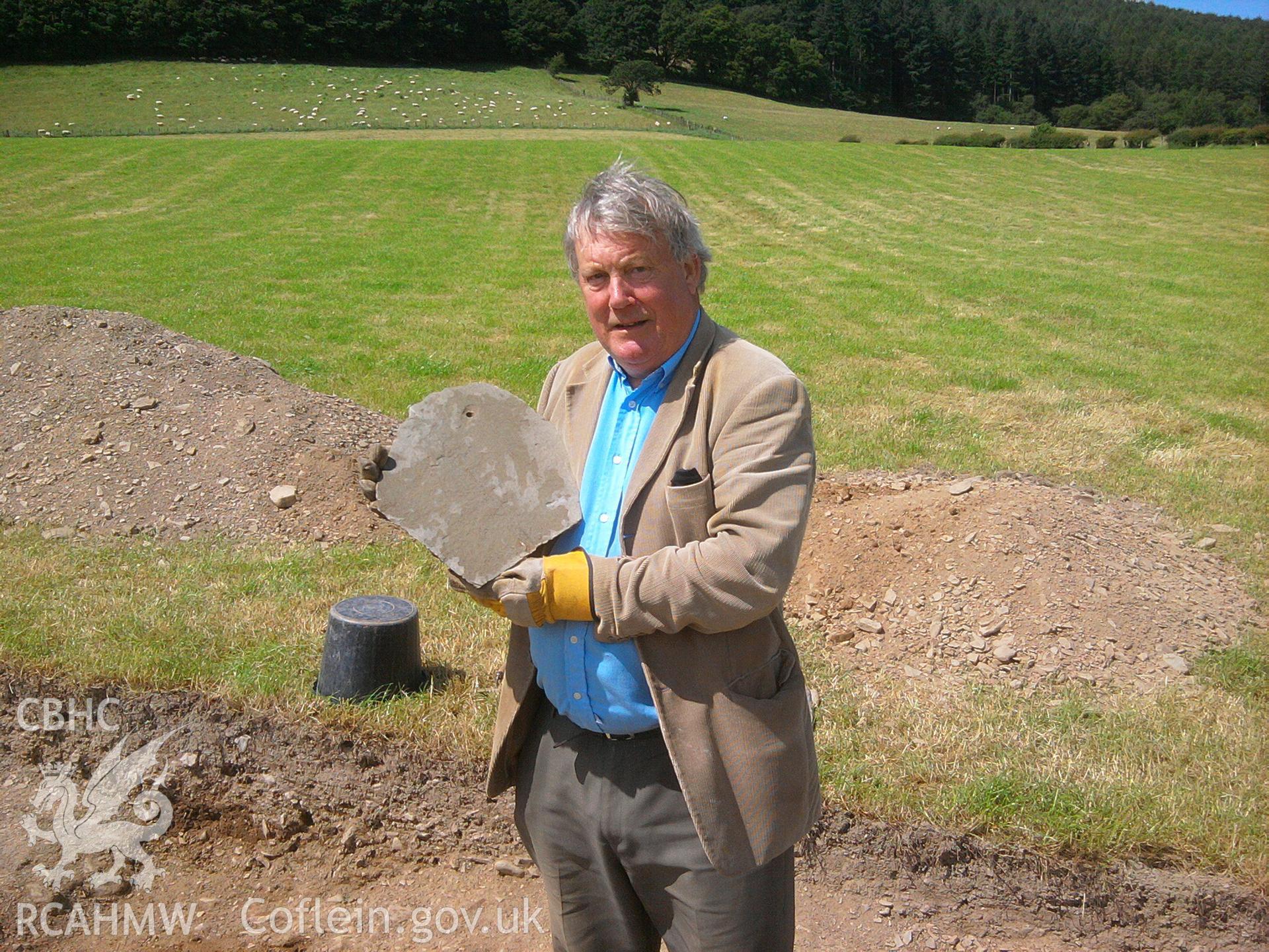 Abermagwr Roman villa; photographs of 2015 excavation season. D. Browne holding Roman roof slate discovered in the inner ditch of Trench G