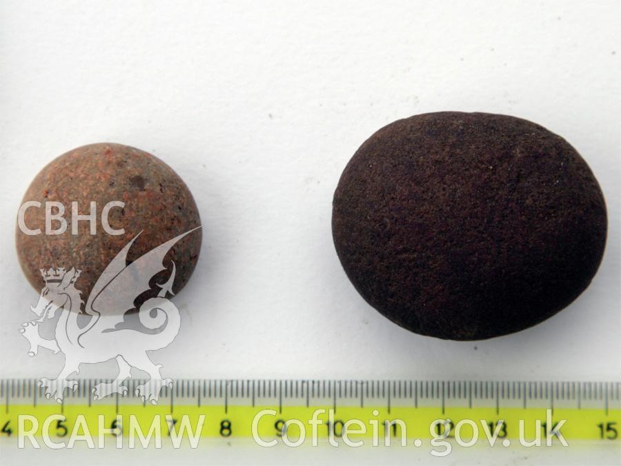 Skomer Island. Finds from excavation of burnt stone mound, Hut Group 8. Finds 12 and 5, possible sling stones.
