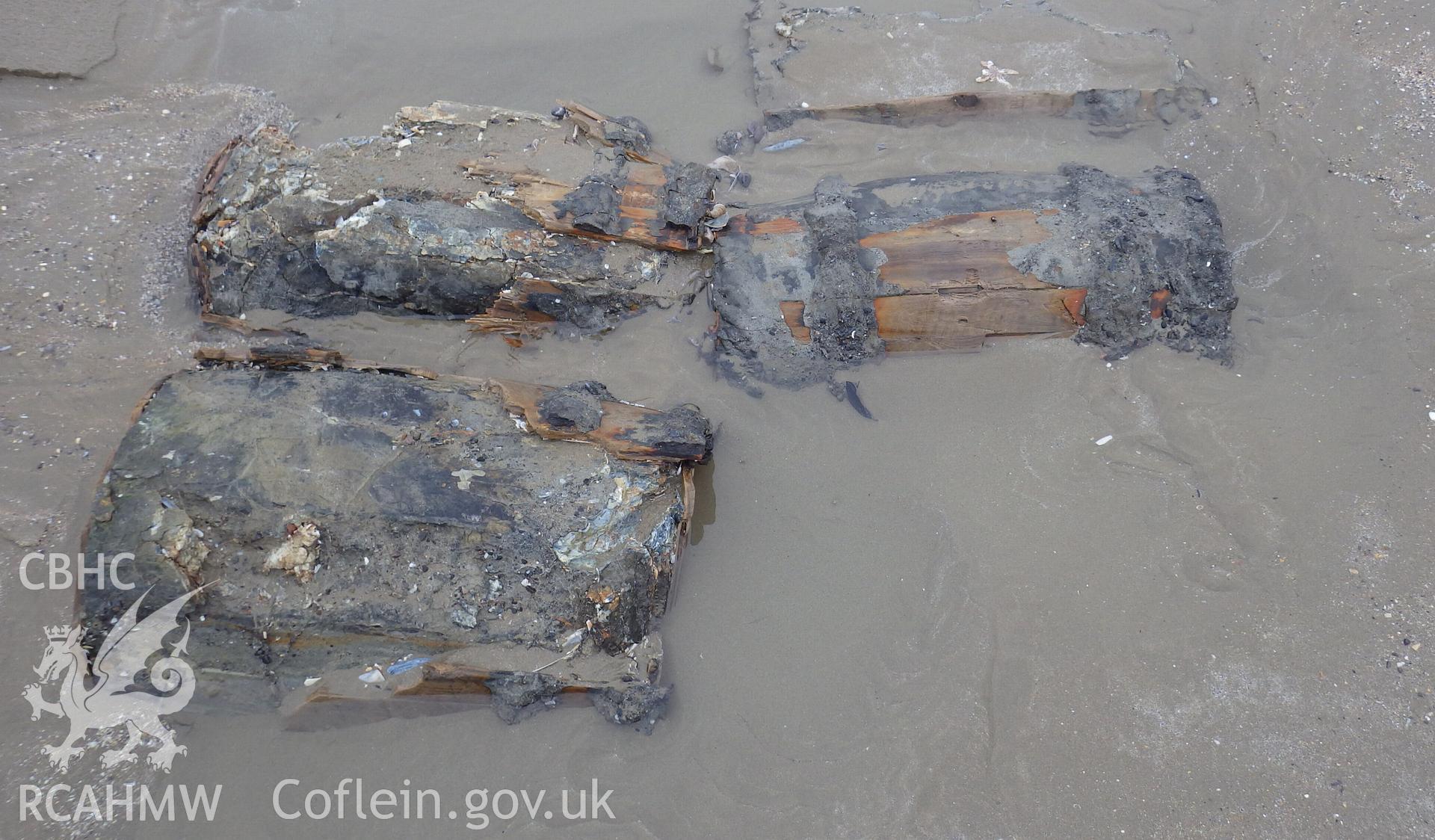 Outer wooden strakes partially eroded away revealing inner coating of pitch