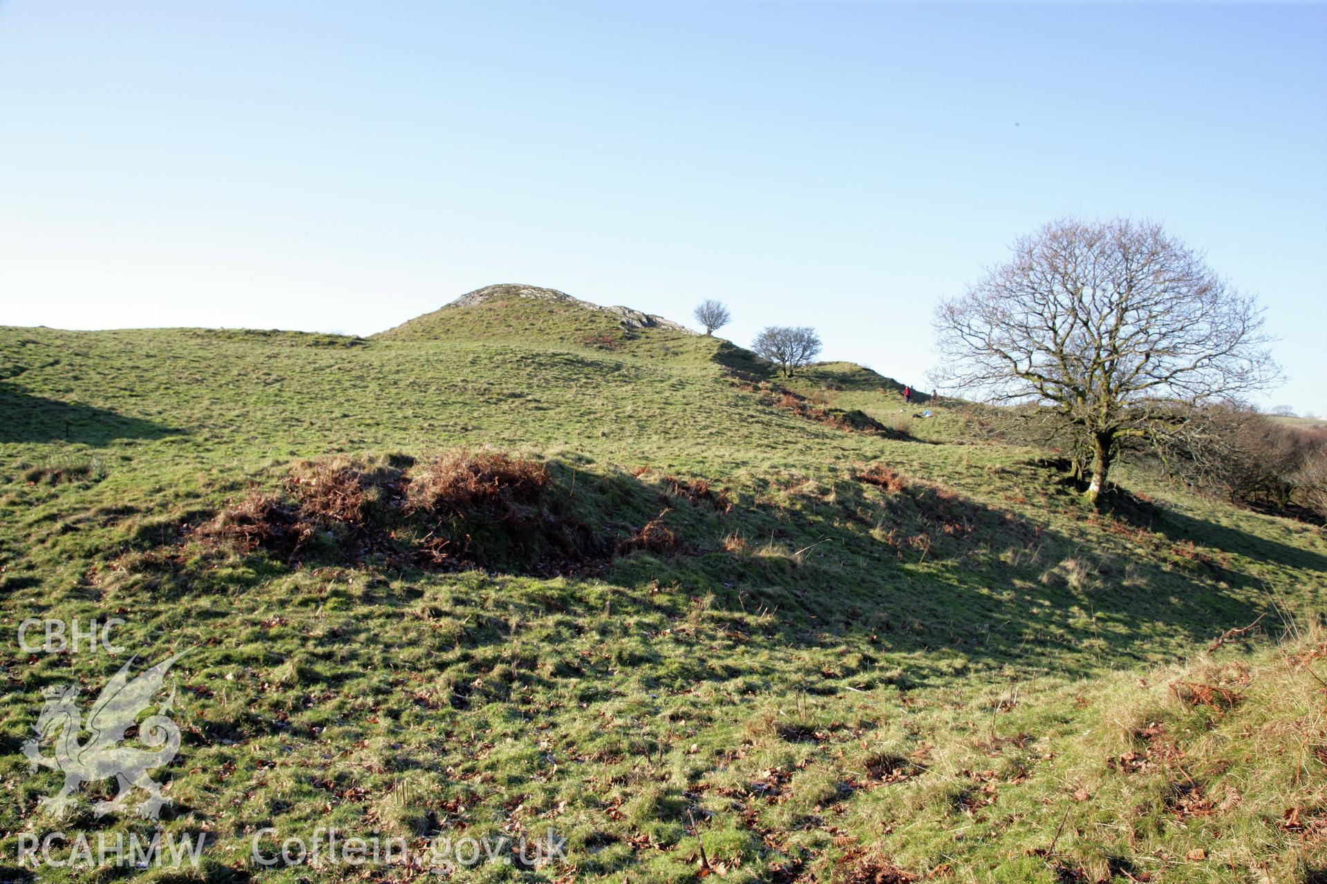 Castell Grogwynion hillfort, Royal Commission survey 2012, general view of earthworks in low light from east