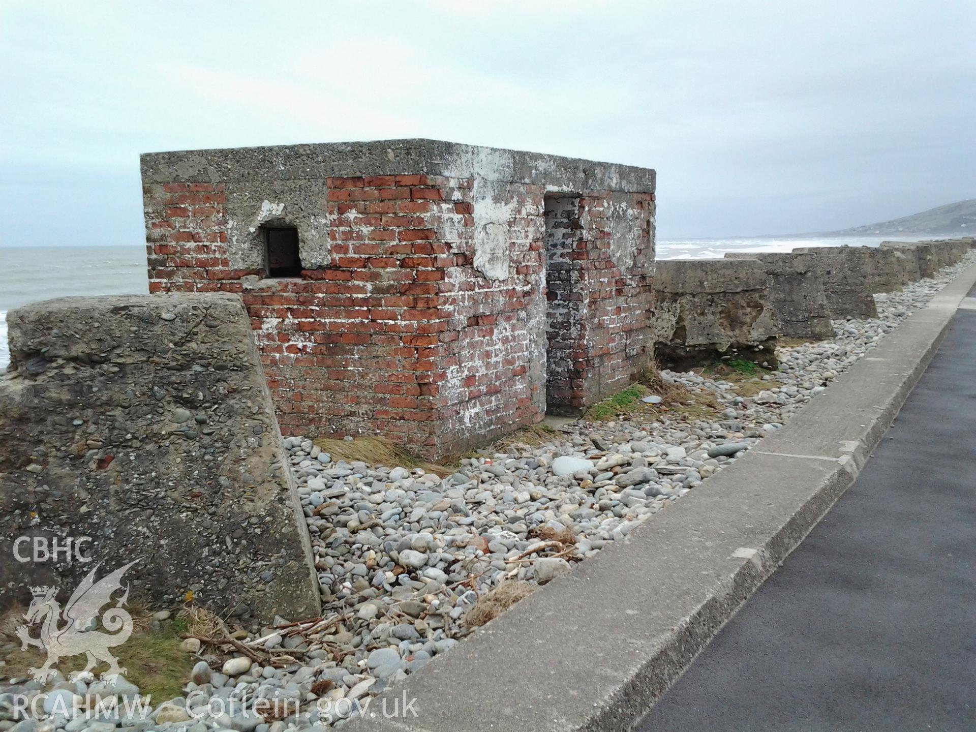 Northwest facing wall of pillbox showing firing loops remaining open.