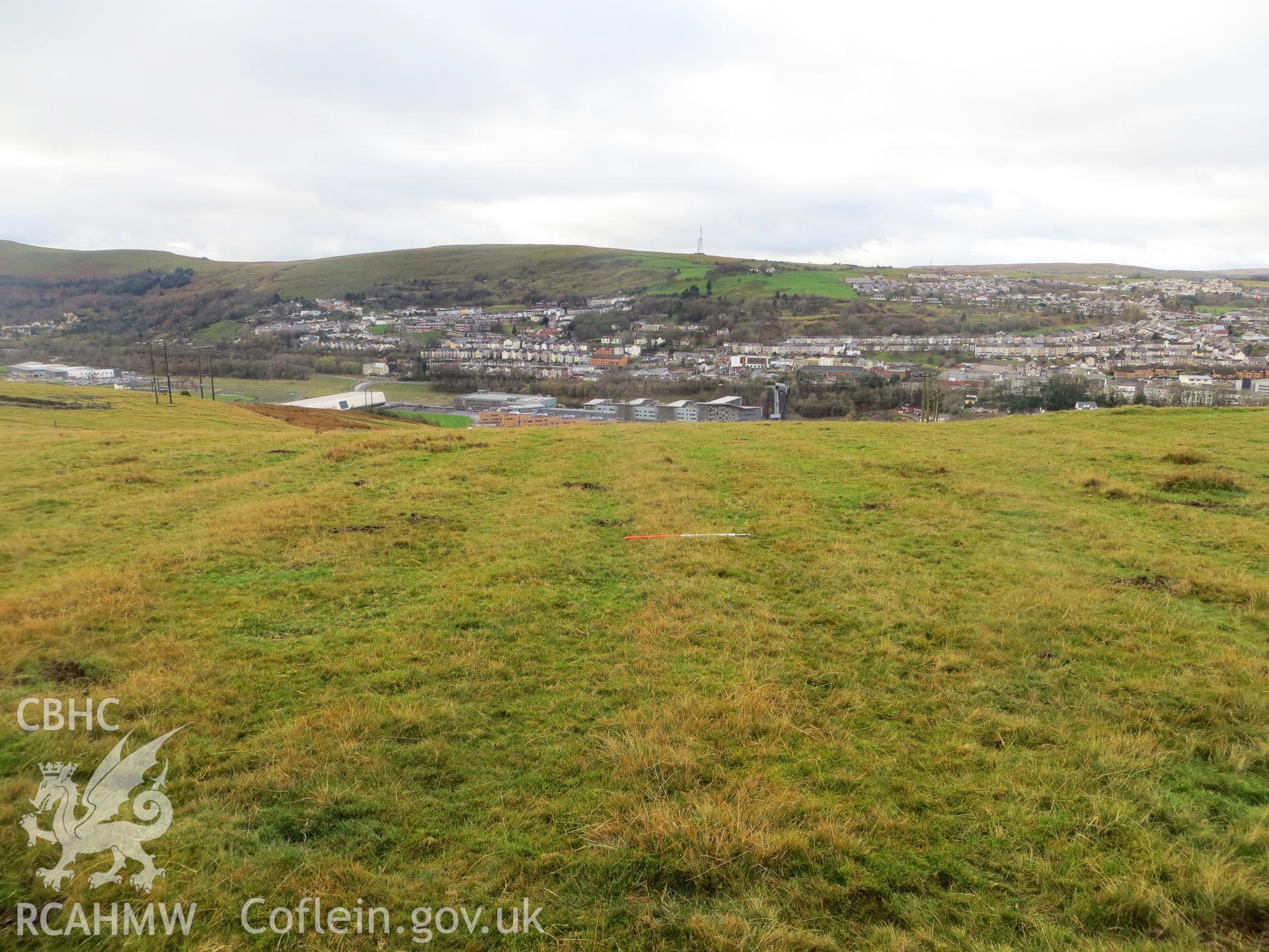 Cultivation ridges outside enclosure with later walled enclosure in background; 1m scale.