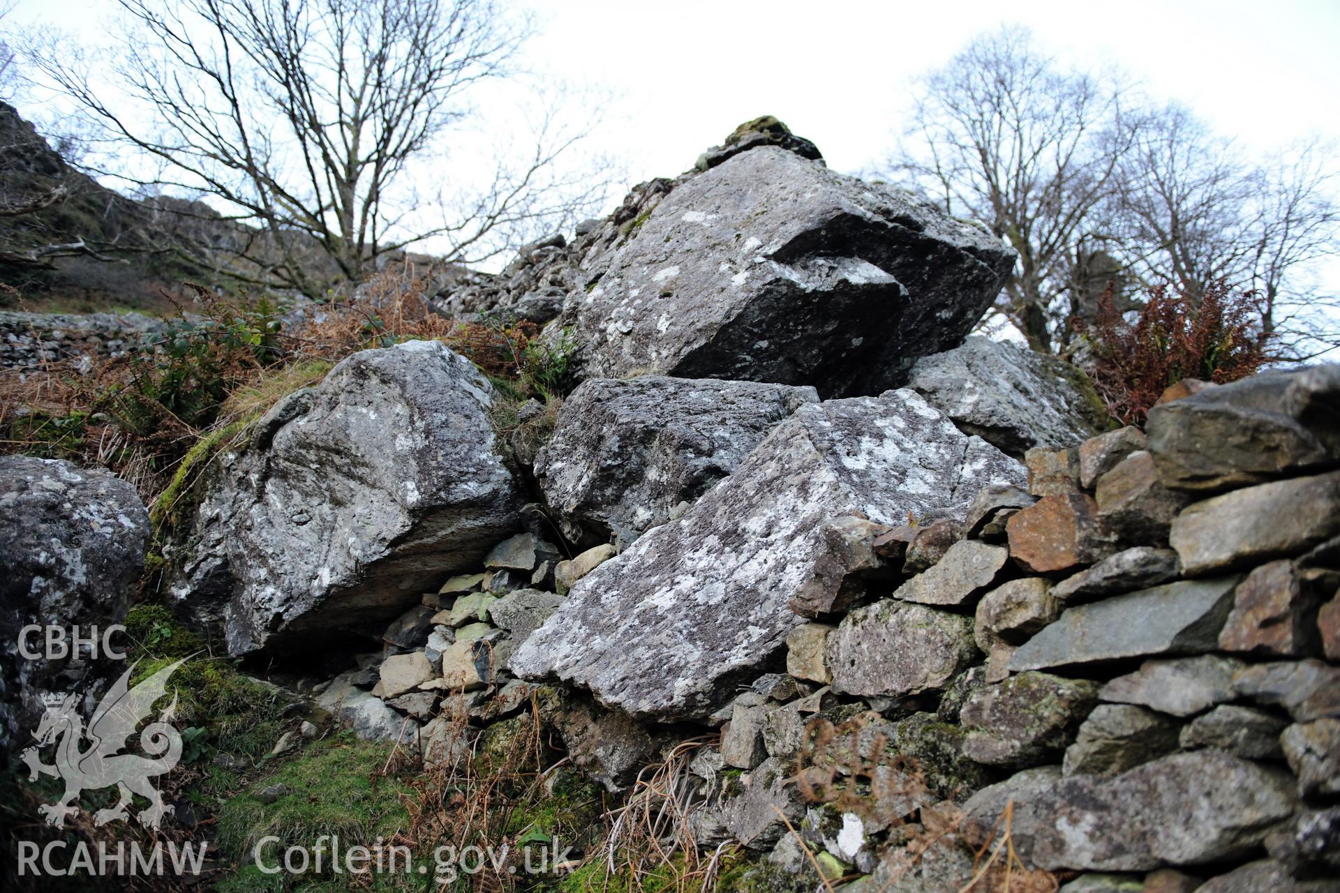 Photo survey of find spot of Tal-y-llyn hoard, beneath naturally-propped boulder alongside path. General view of boulder