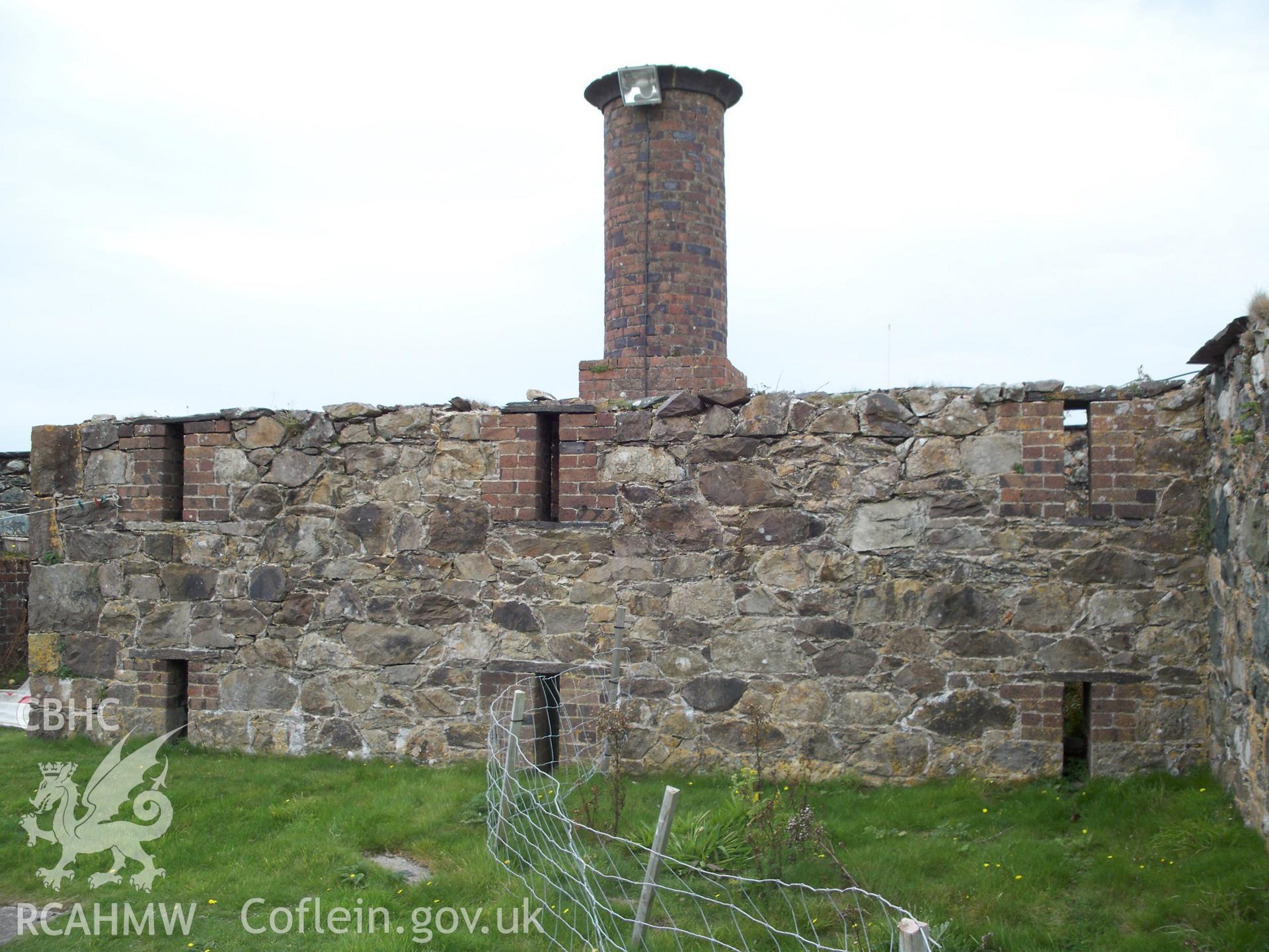 De-roofed forge/chain foundry building with chimnet still standing