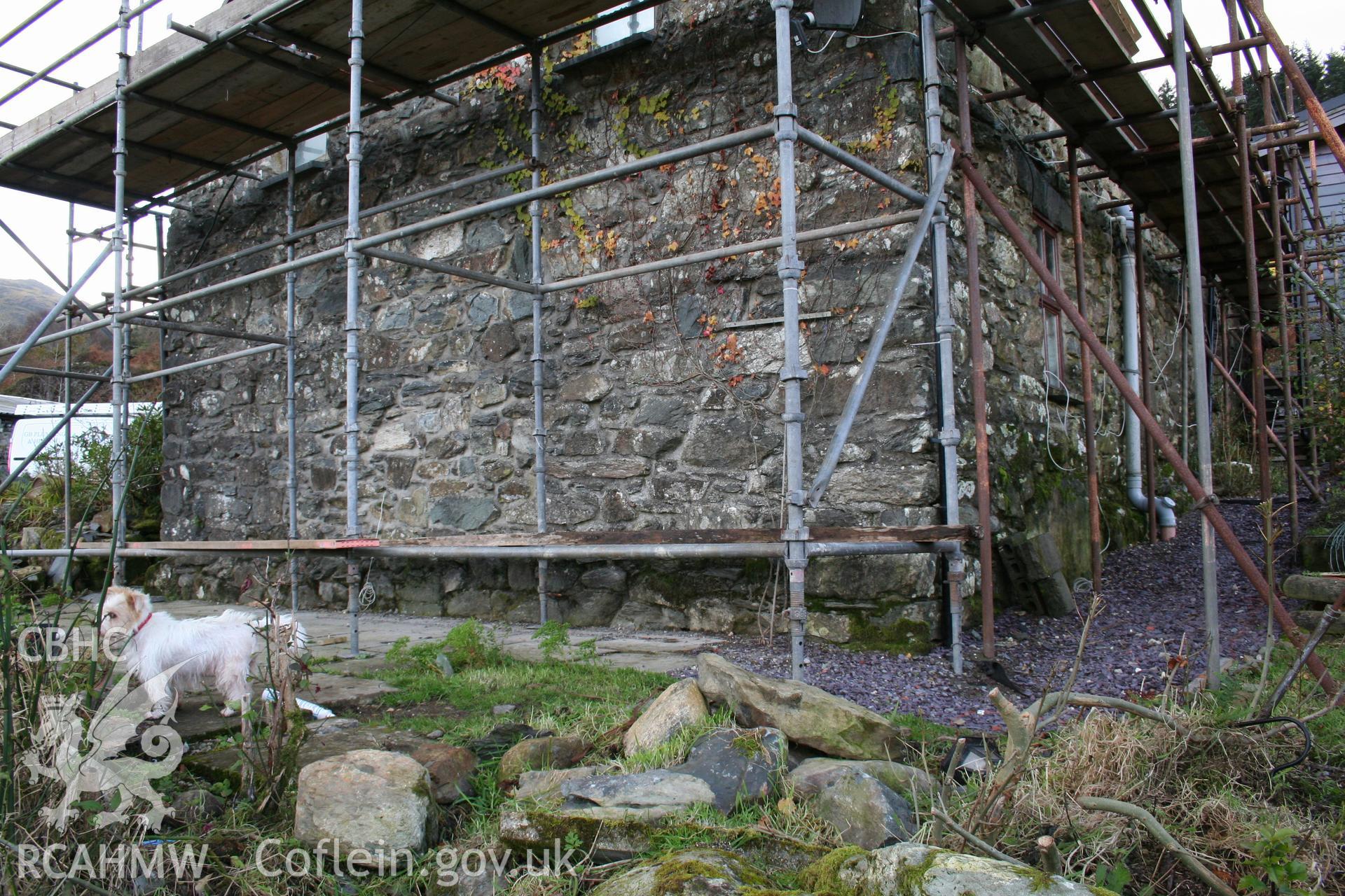 Exterior: east elevation, showing platform and stone base.