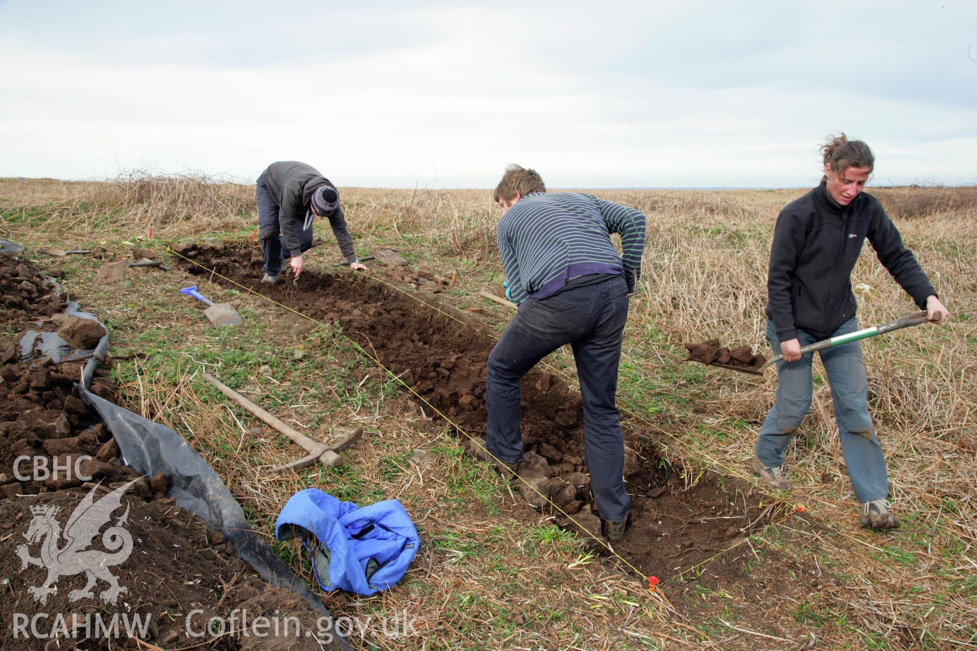 Skomer Island excavation of a burnt stone mound, Hut Group 8. Excavation trench from the south-west