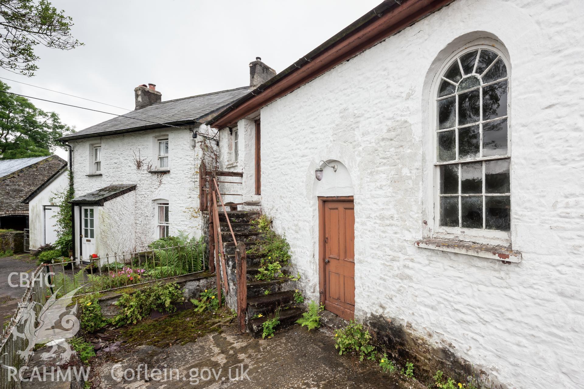 Oblique view of entrance door and external steps