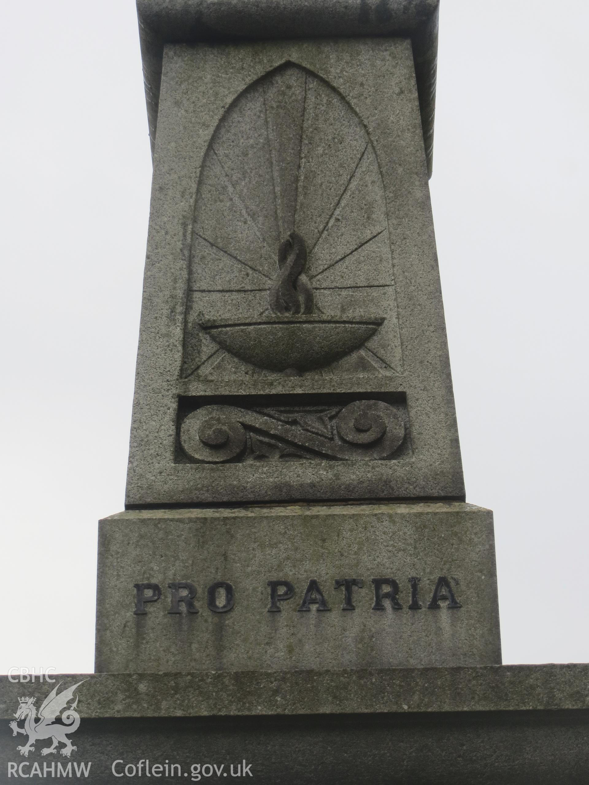 Upper segment of column, east face, with panel detail.