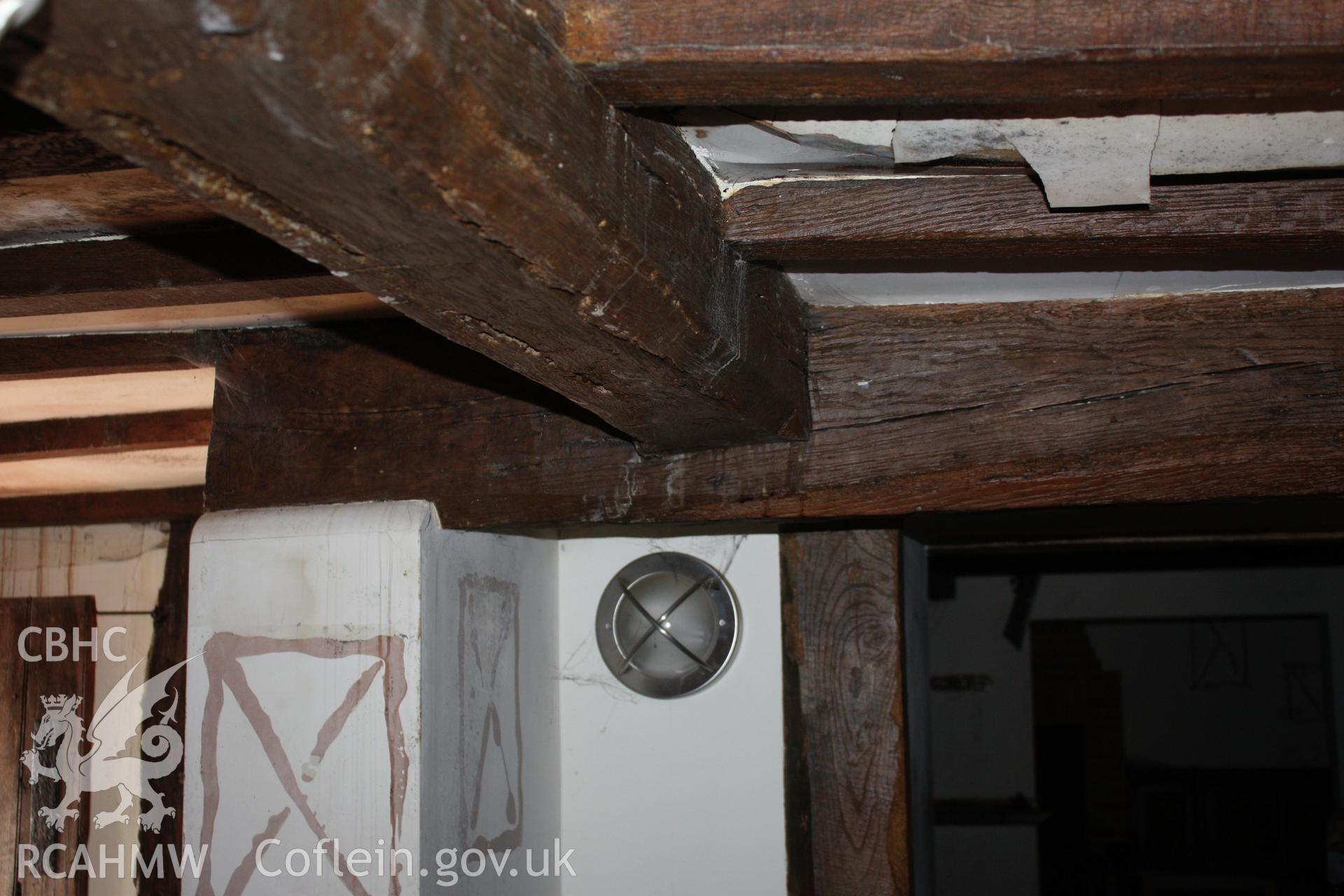 Hall fireplace bresummer, with ceiling-beam and joists
