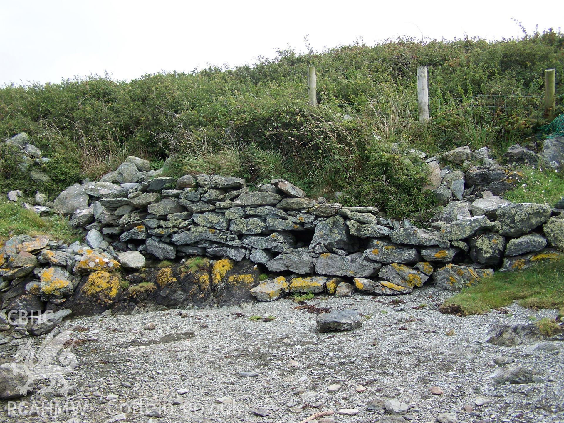 Rubblestone revetment protecting the footpath descent to the northern end of the dam