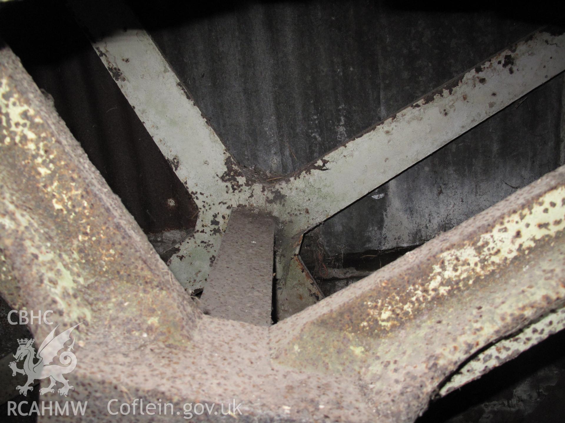 Detail of waterwheel and axle in Maes-y-coed Farm outbuilding.