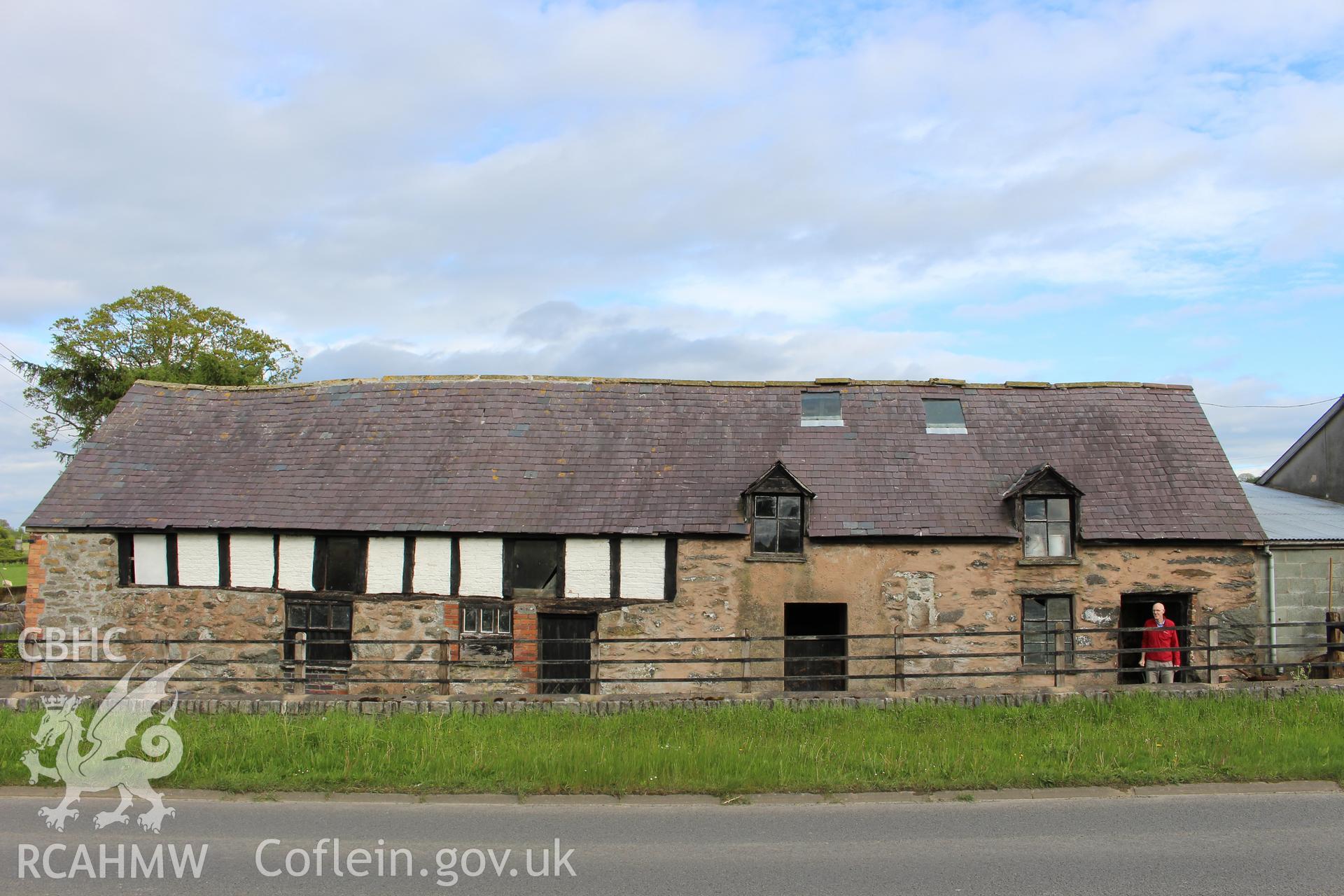 Exterior; west elevation of Four Crosses, with Geoff Ward in entrance.