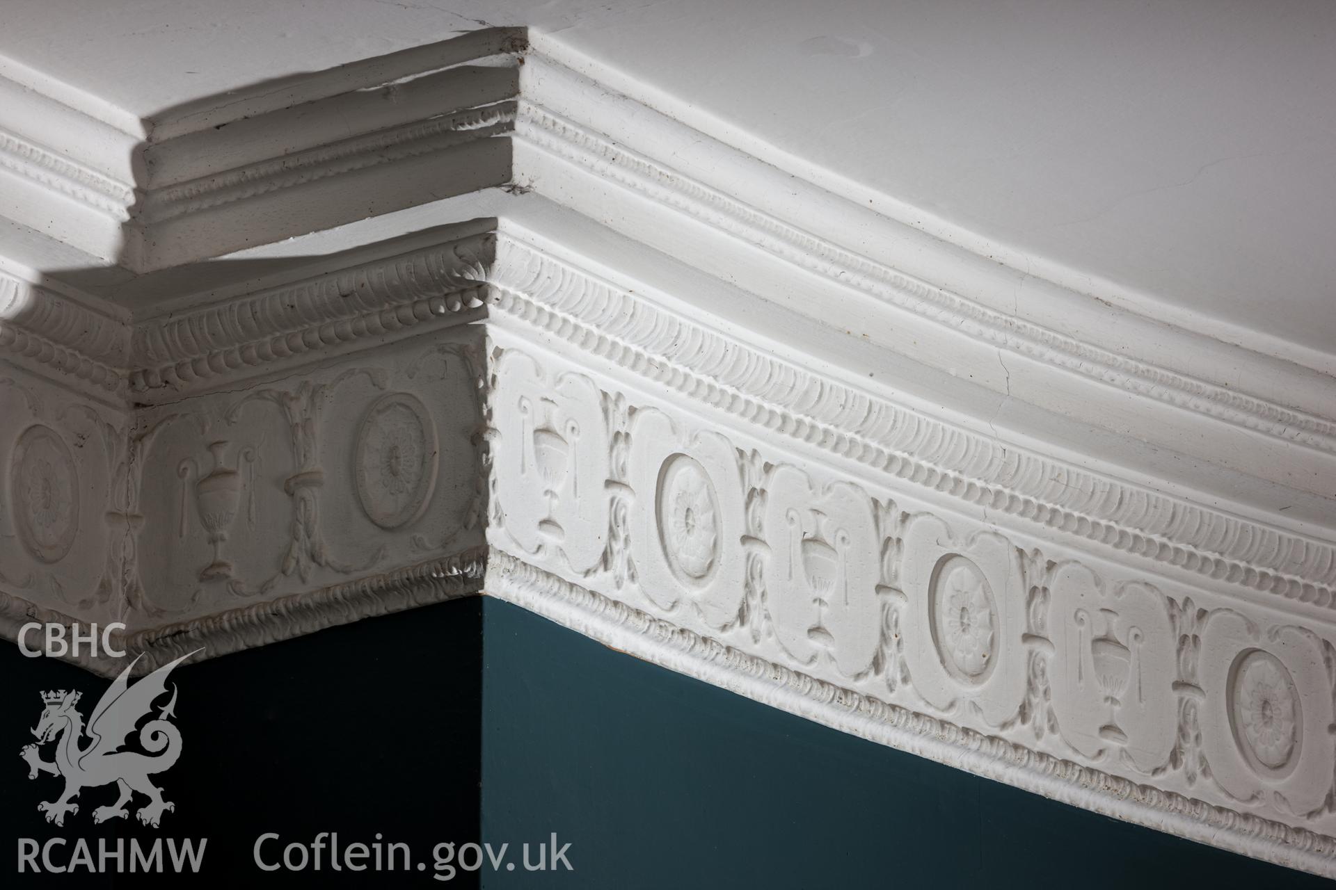Fireplace detail repeated on ceiling cornice