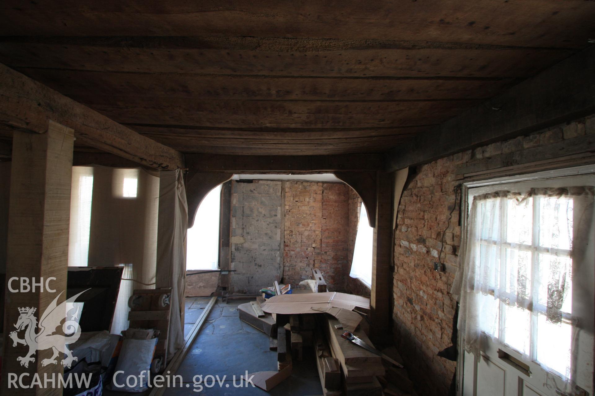 Interior: repair work to timber framing of cross-wing, with 19th century brick extension and infill.