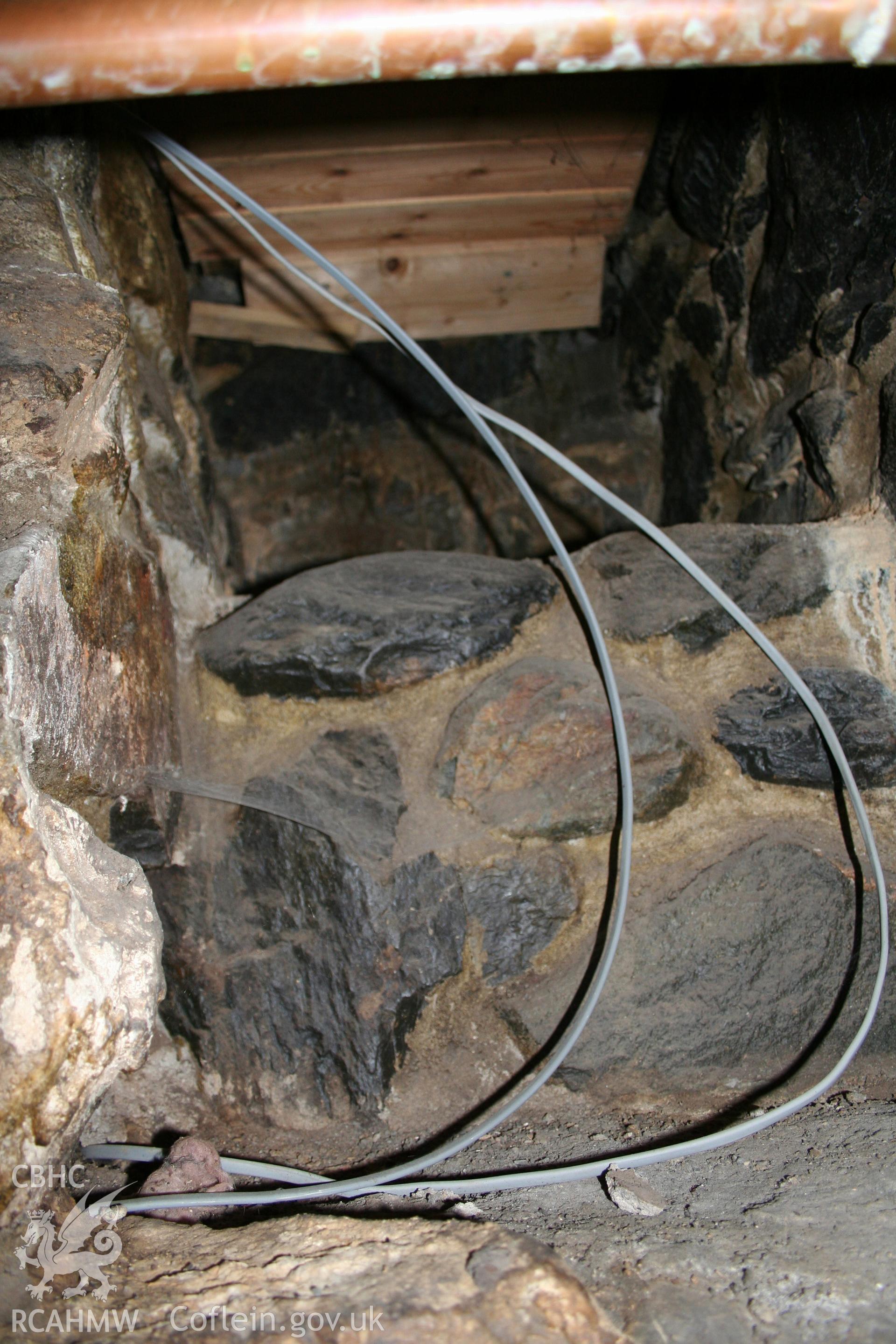 Interior: stepped storage to rear top left of fireplace.