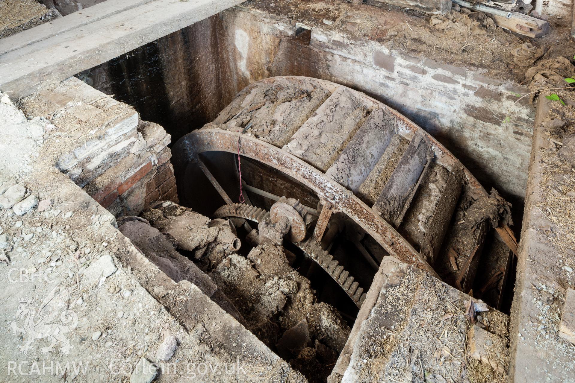 Waterwheel in southwest wing of farm yard