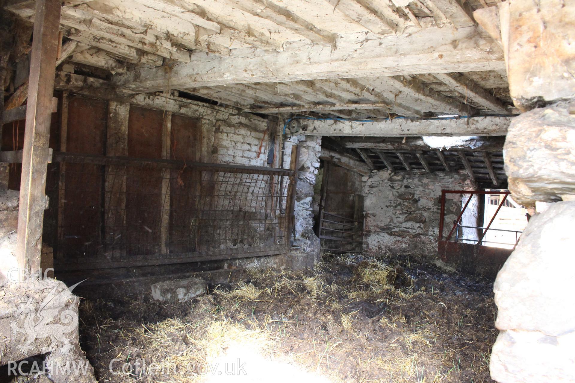 Interior; kitchen showing axial beam and joists, with timber partition.