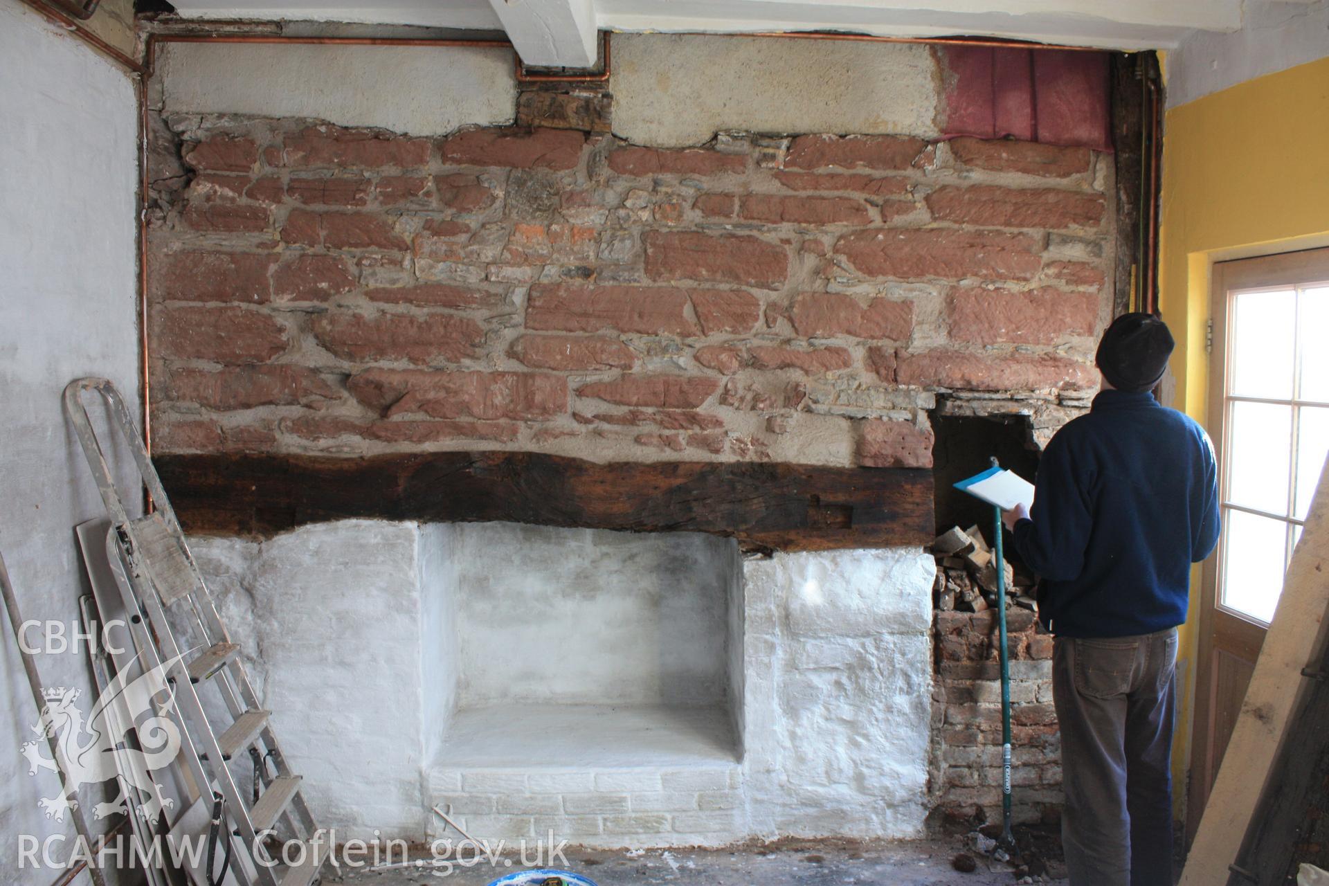 Interior: inserted fireplace in hall, also in frame is Geoff Ward.