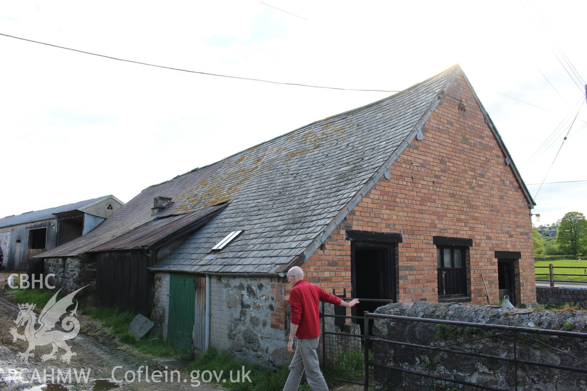 Exterior; north elevation, bricked in 1960s, Geoff Ward in frame.