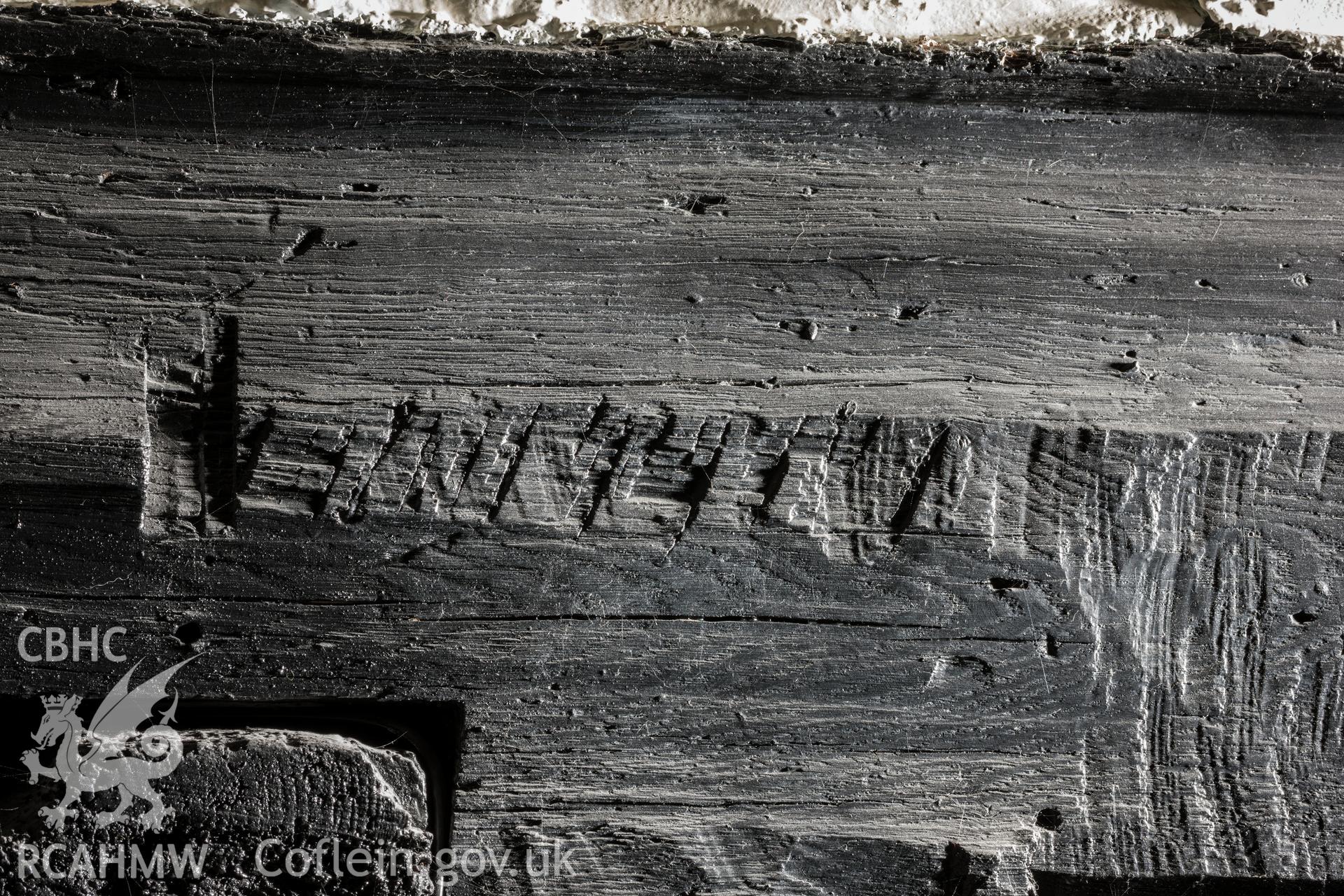 Decorative moulding cut away from face of beam, left side