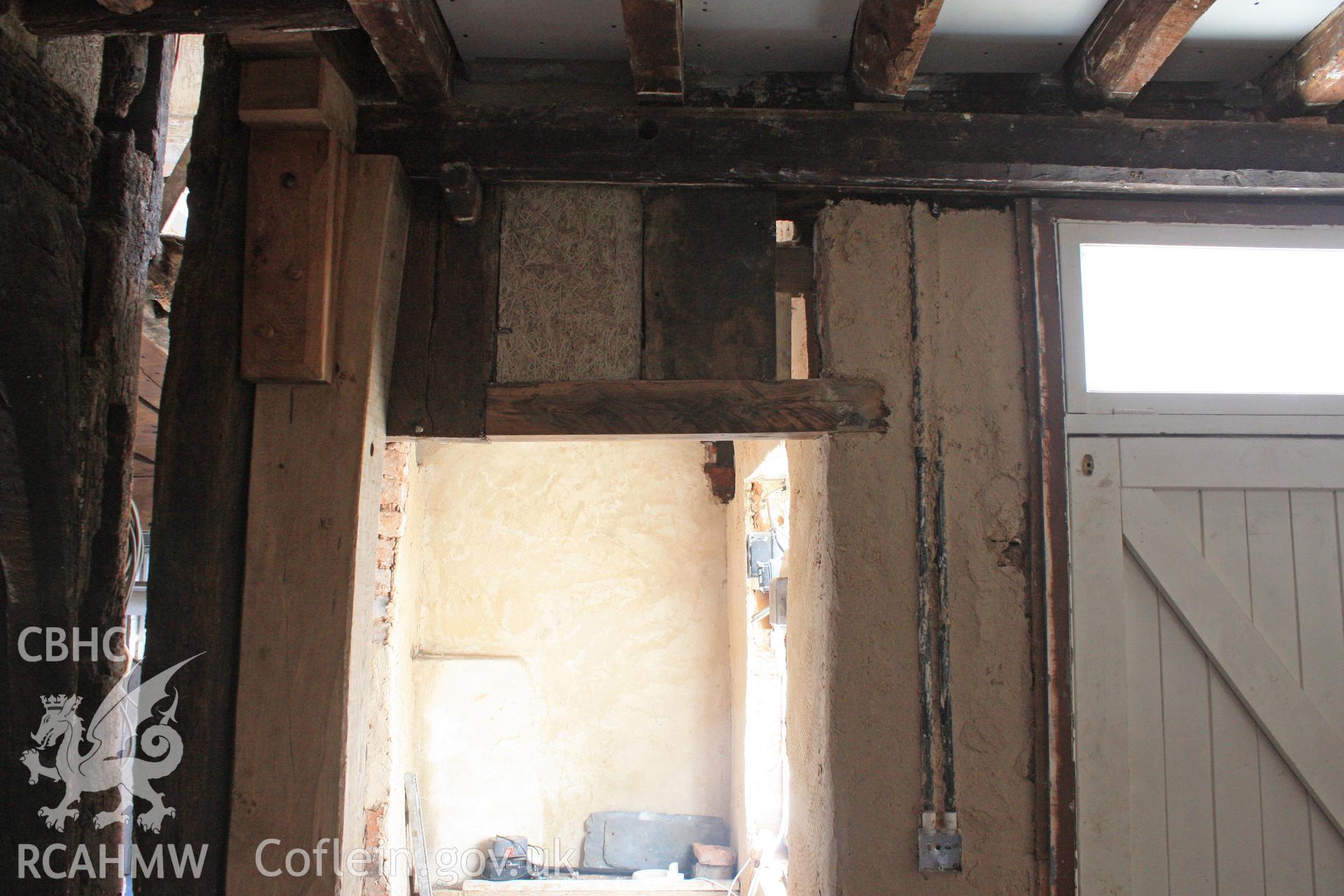 Interior: remains of studs, cut back to create doorway.