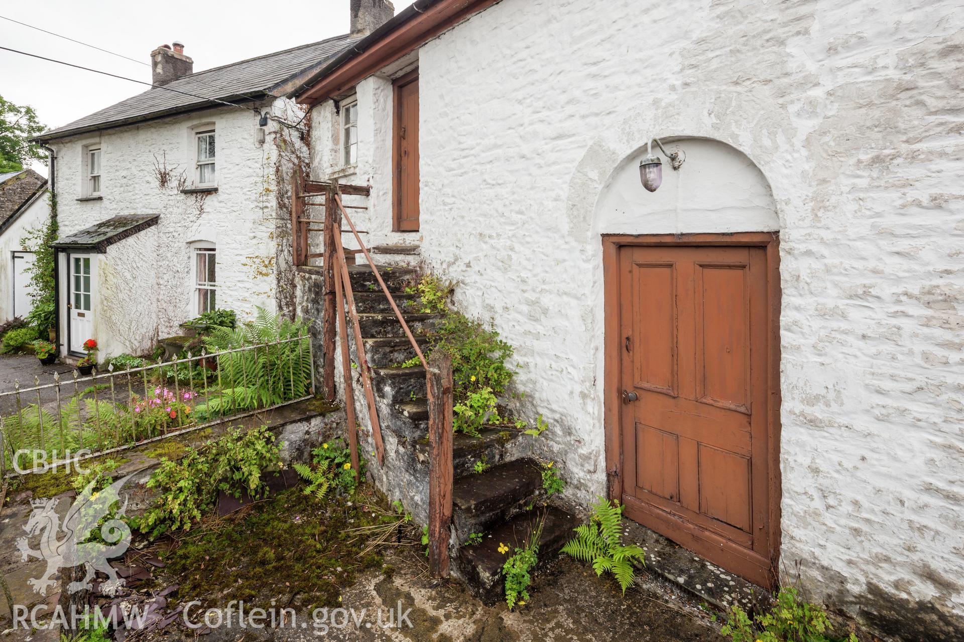 Oblique view of entrance door and external steps