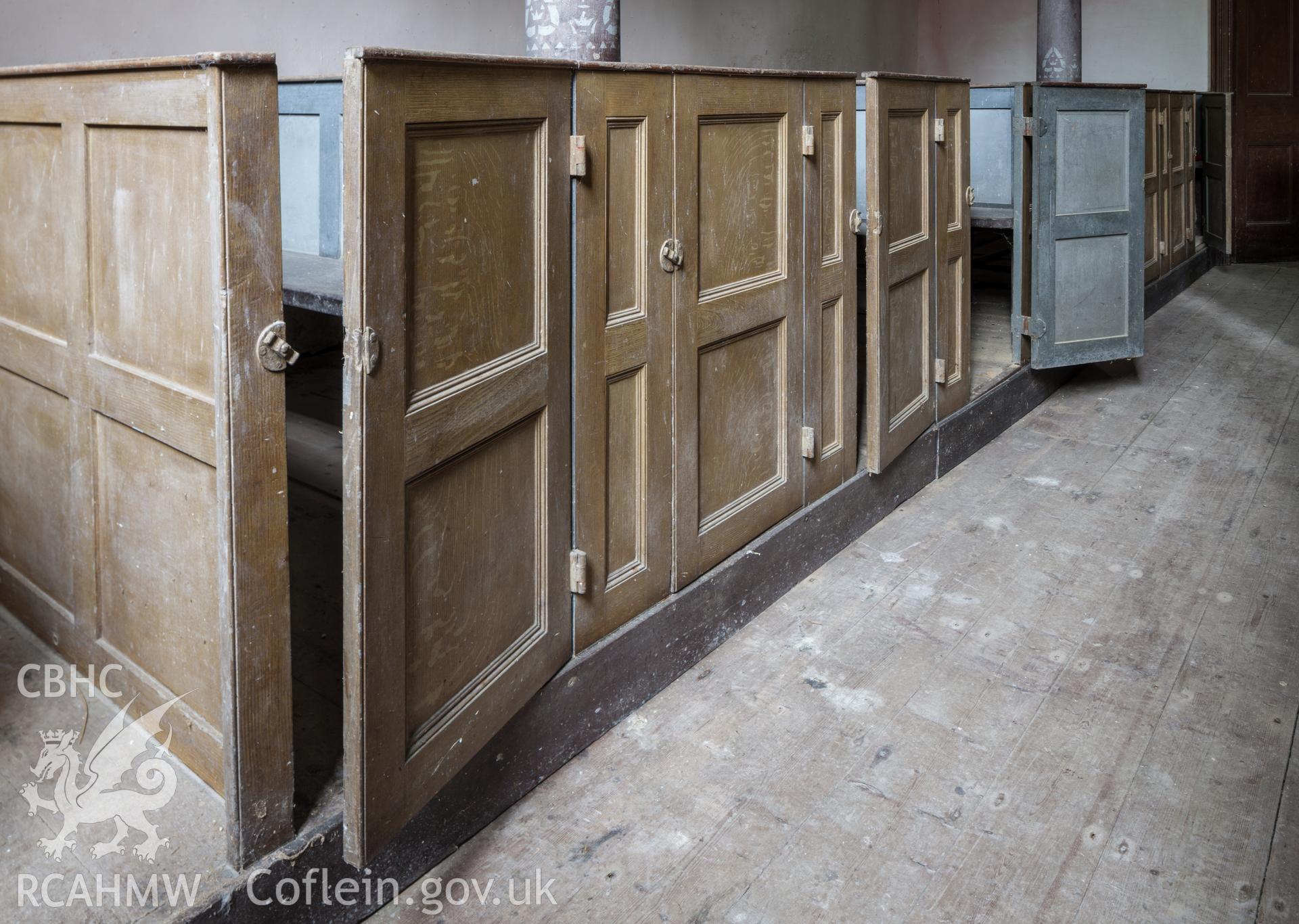 Interior, detail of box pew doors on northeast
