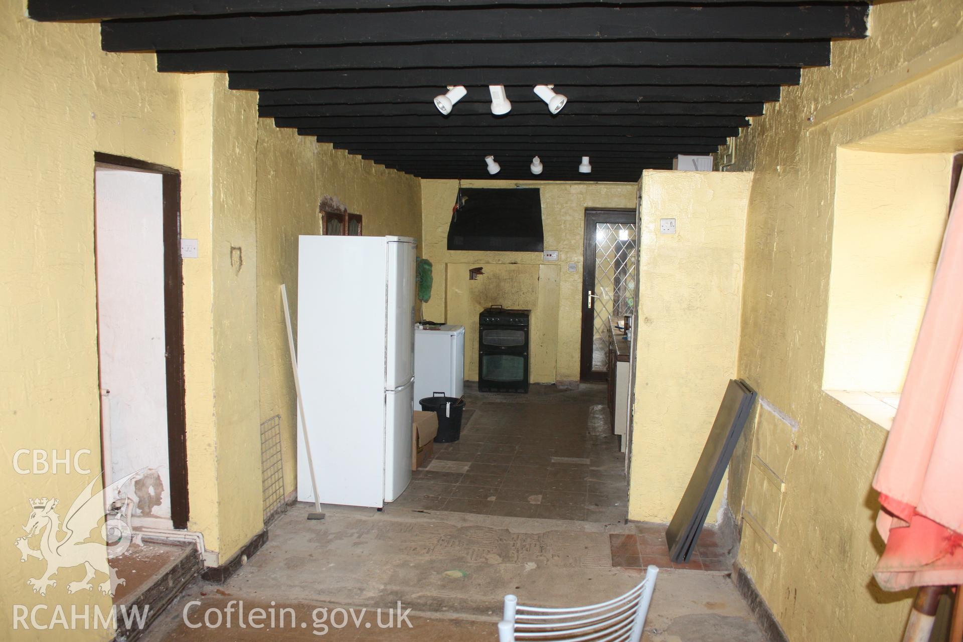 Interior; C19th kitchen, with stub of earlier dividing wall to left of photo