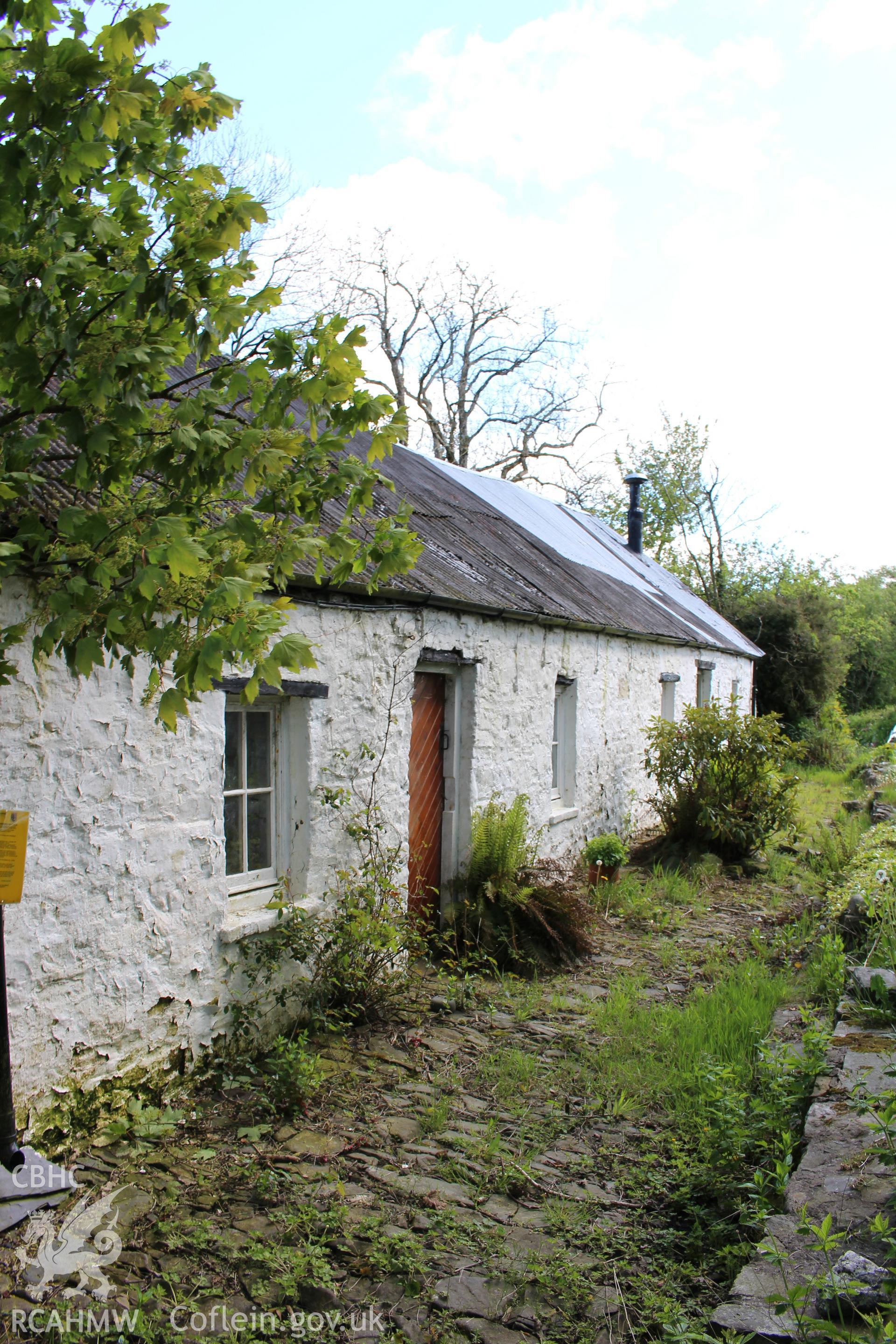 Exterior: west elevation, showing cobbling.