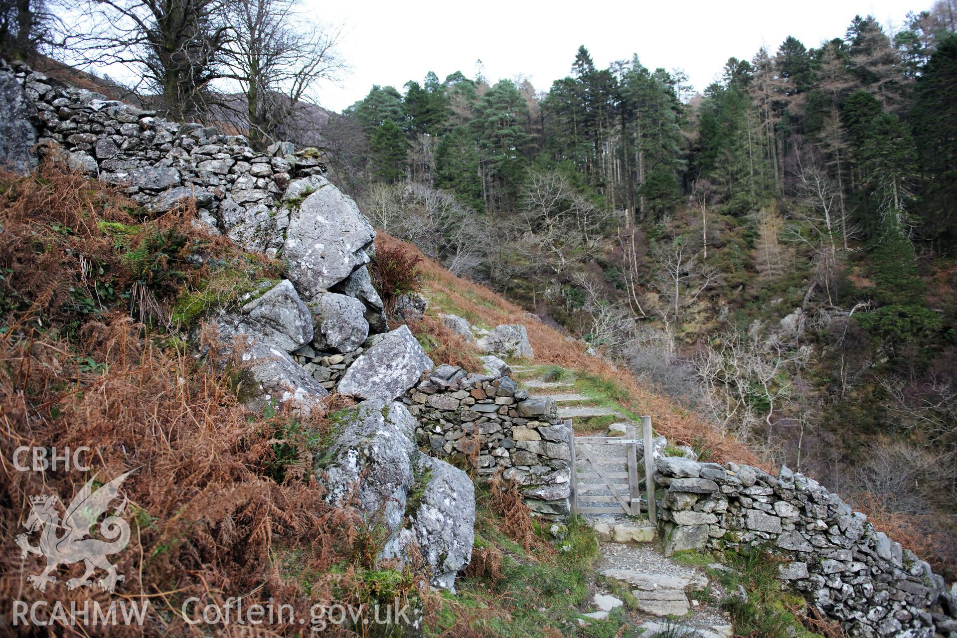 Photo survey of find spot of Tal-y-llyn hoard, beneath naturally-propped boulder alongside path. General view of site