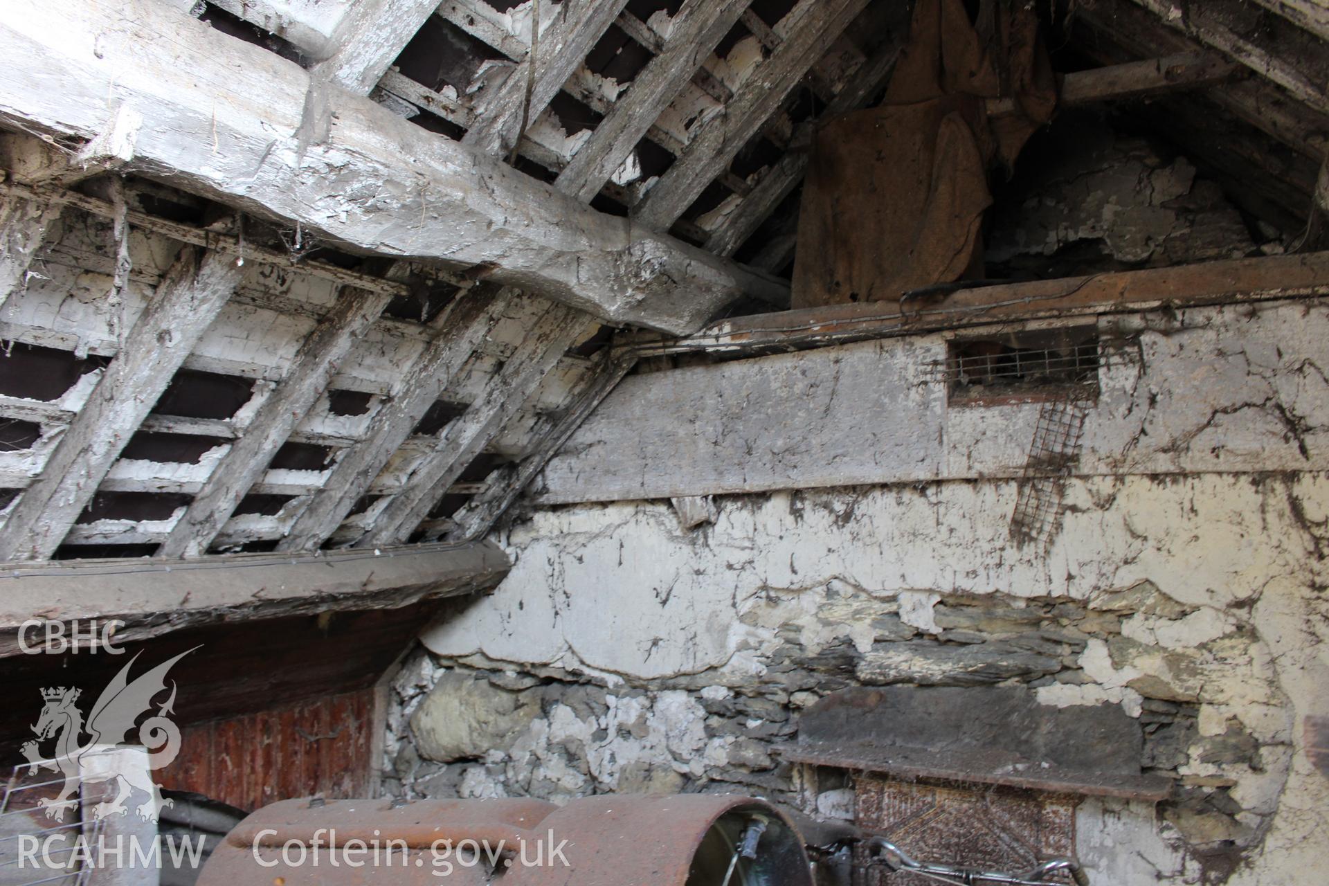 Interior; chimney breast and large purlins.