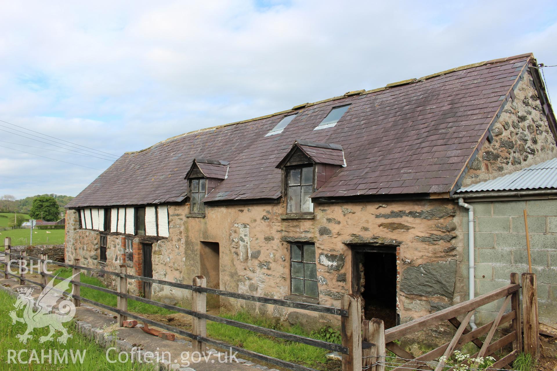 Exterior; west elevation showing both barn and house