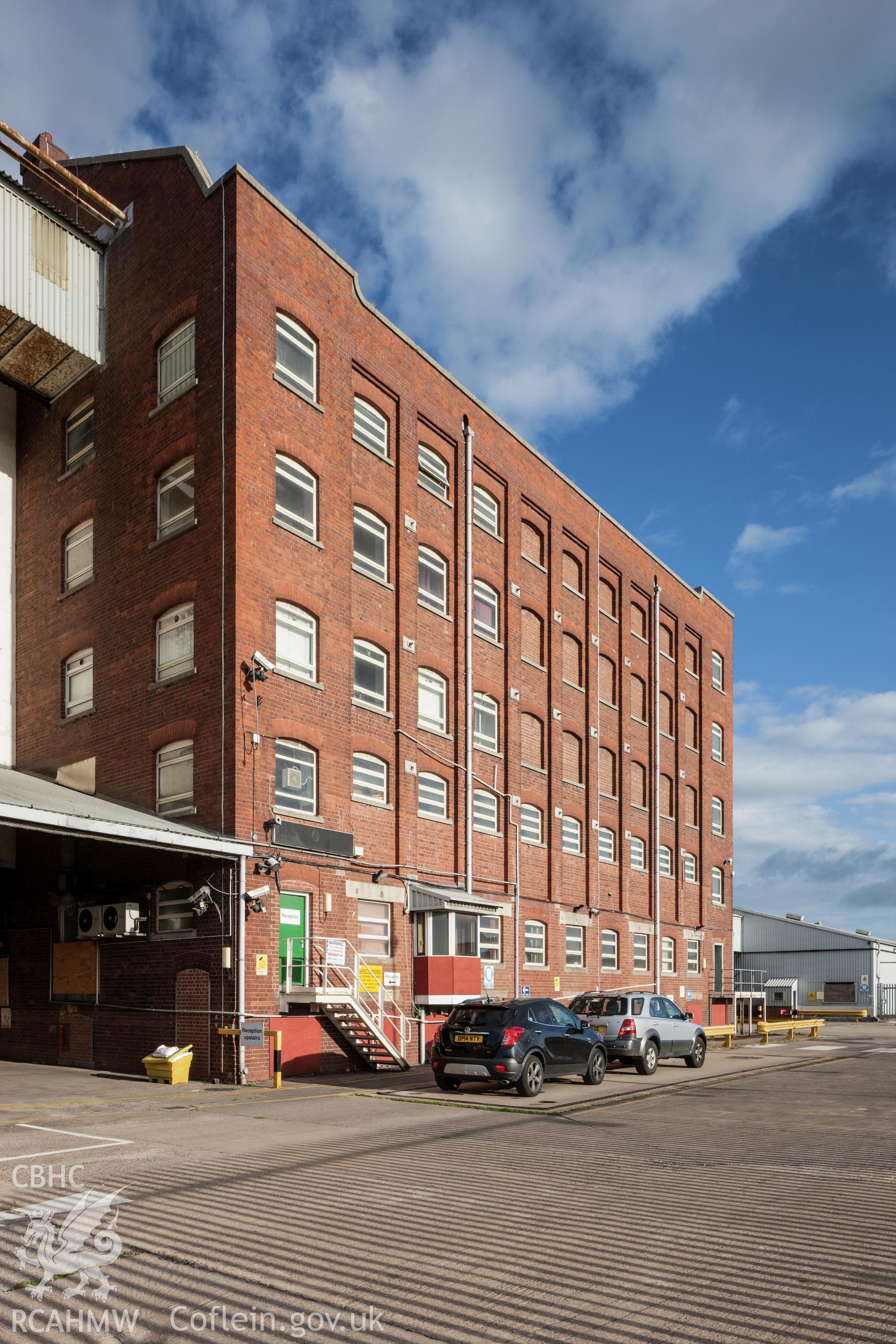 Exterior from the south, vehicles parked on entry weighbridge