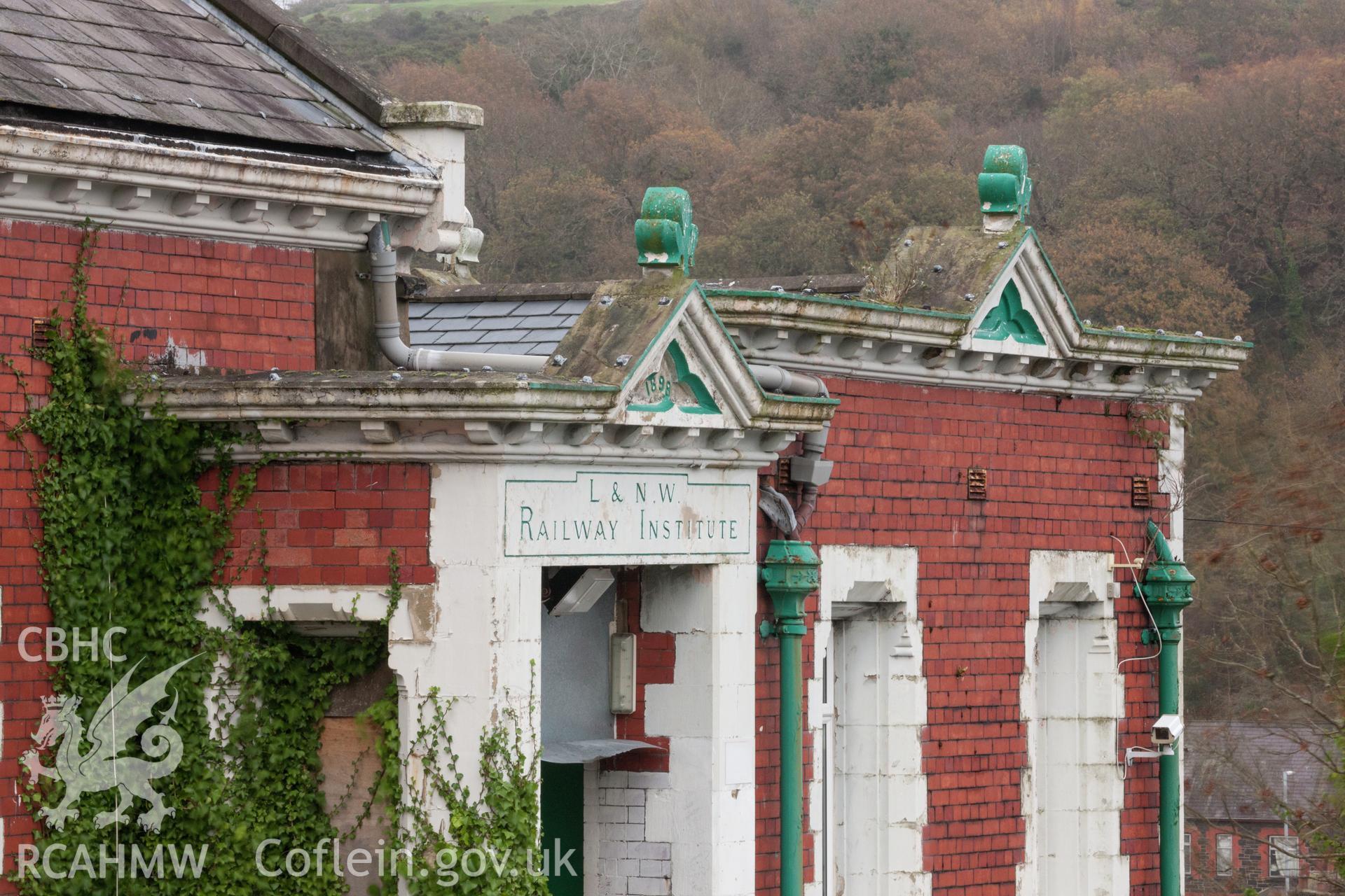 Decorative pediment detail over entrance steps