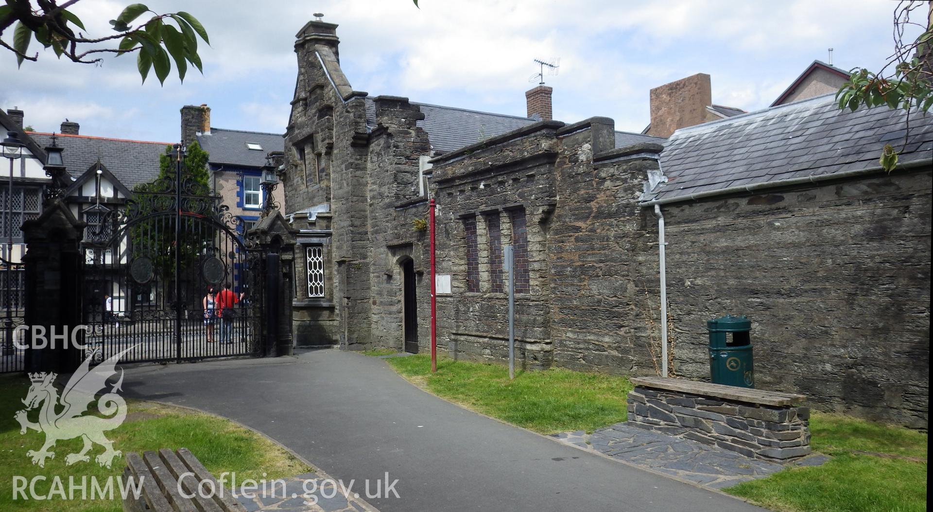 Western elevation, gates and wall flanking the drive (also listed)