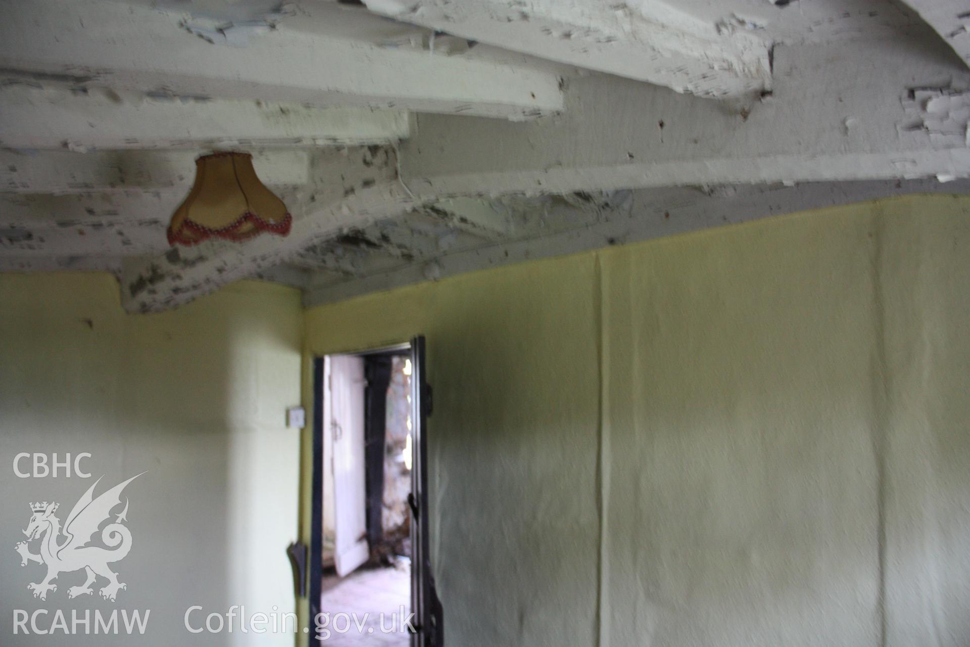 Interior, parlour showing cranked ceiling-beam.