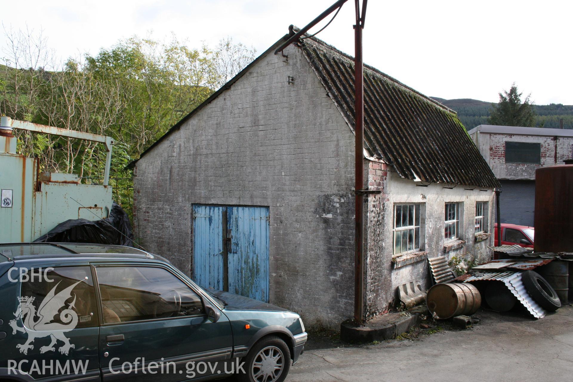 View from the northwest of the generator house at Hufenfa Meirion Milk Depot.