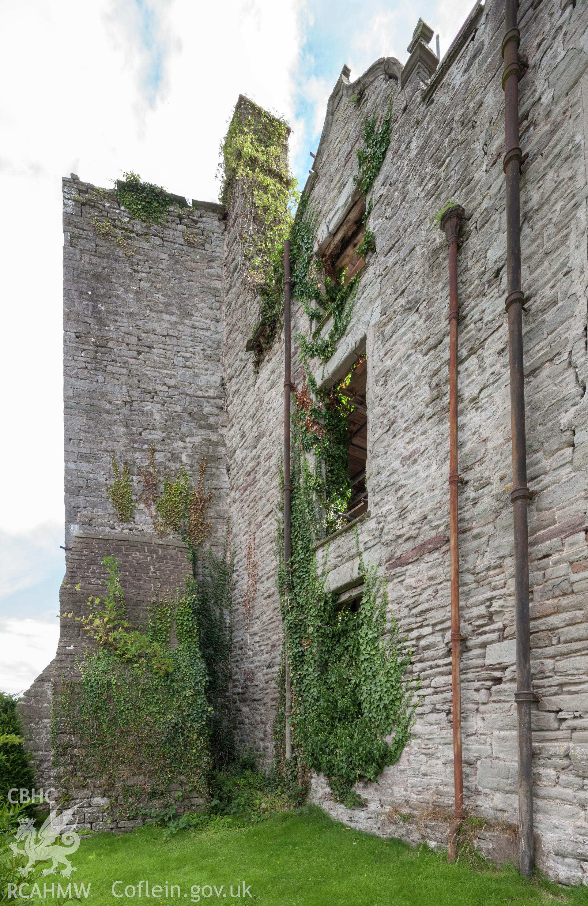 Straight joint in castle wall (north side) showing join between later castle house and tower, visible to the left of near downpipe