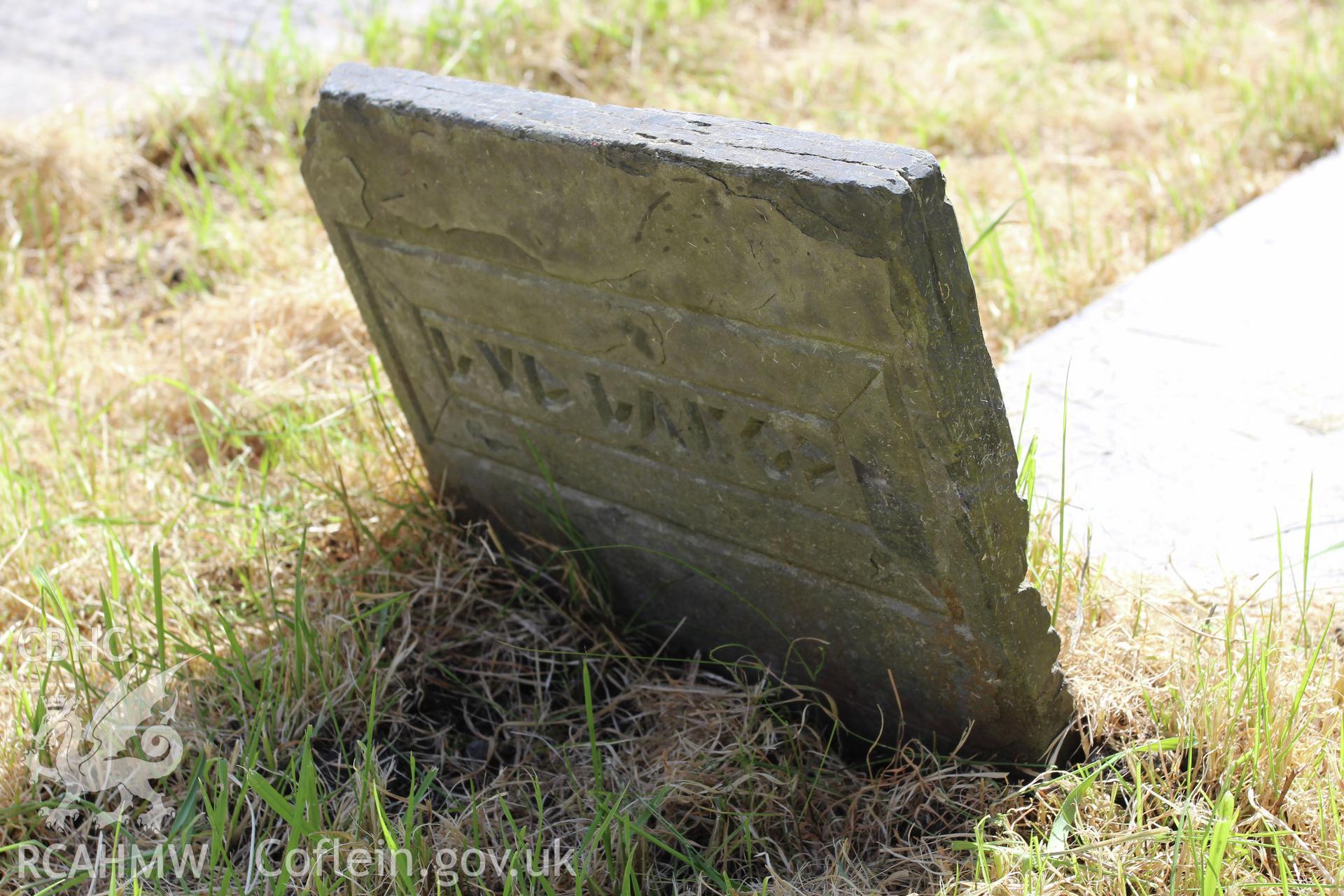 Detail of footstone with a Coelbren Y Beirdd inscription