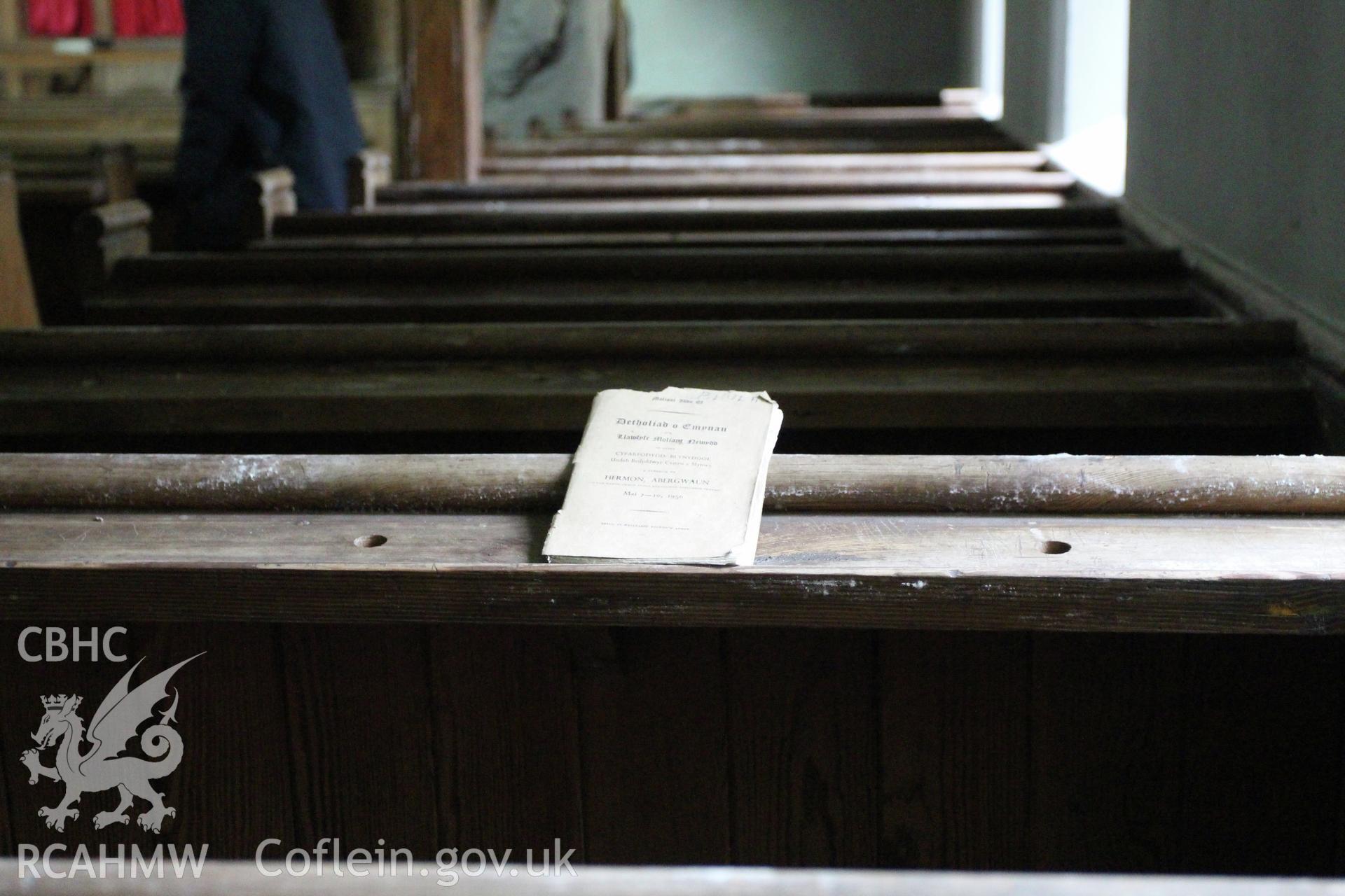 Detail of pew backs and hymn book